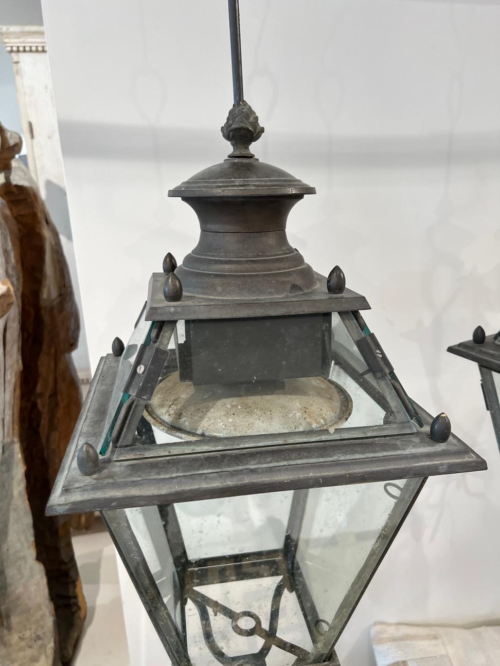 These lanterns were created in Genoa, which has a famous landmark, Lanterna di Genova (Lighthouse of Genoa); many consider this lighthouse to be a symbol of the city. These lanterns would look regal in front of your home. 
Must be rewired for US