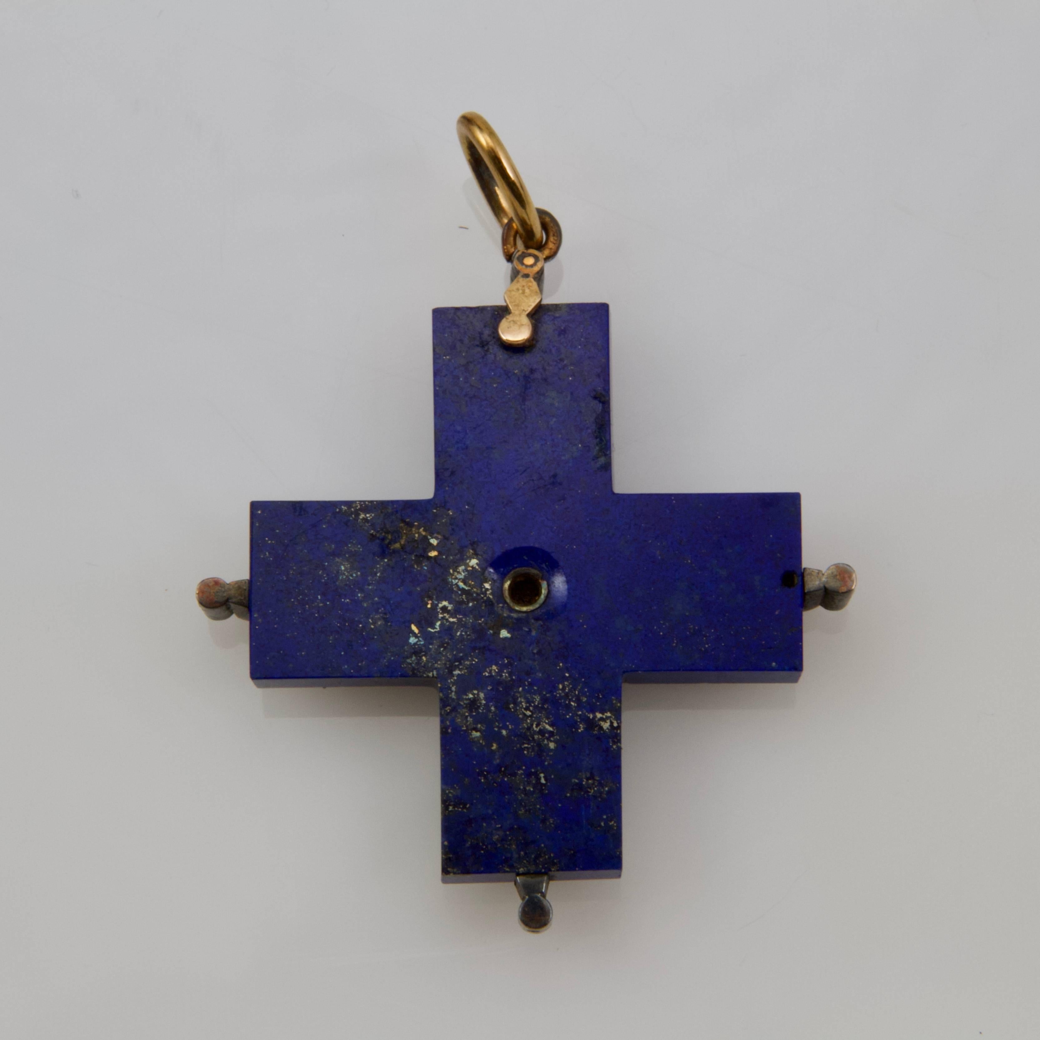 Very charming and chic lapis-lazuli cross set on silver with 17 small antique cut diamonds. The ring in gold. 
Weight: 18.4 gr
French recense marks. 
