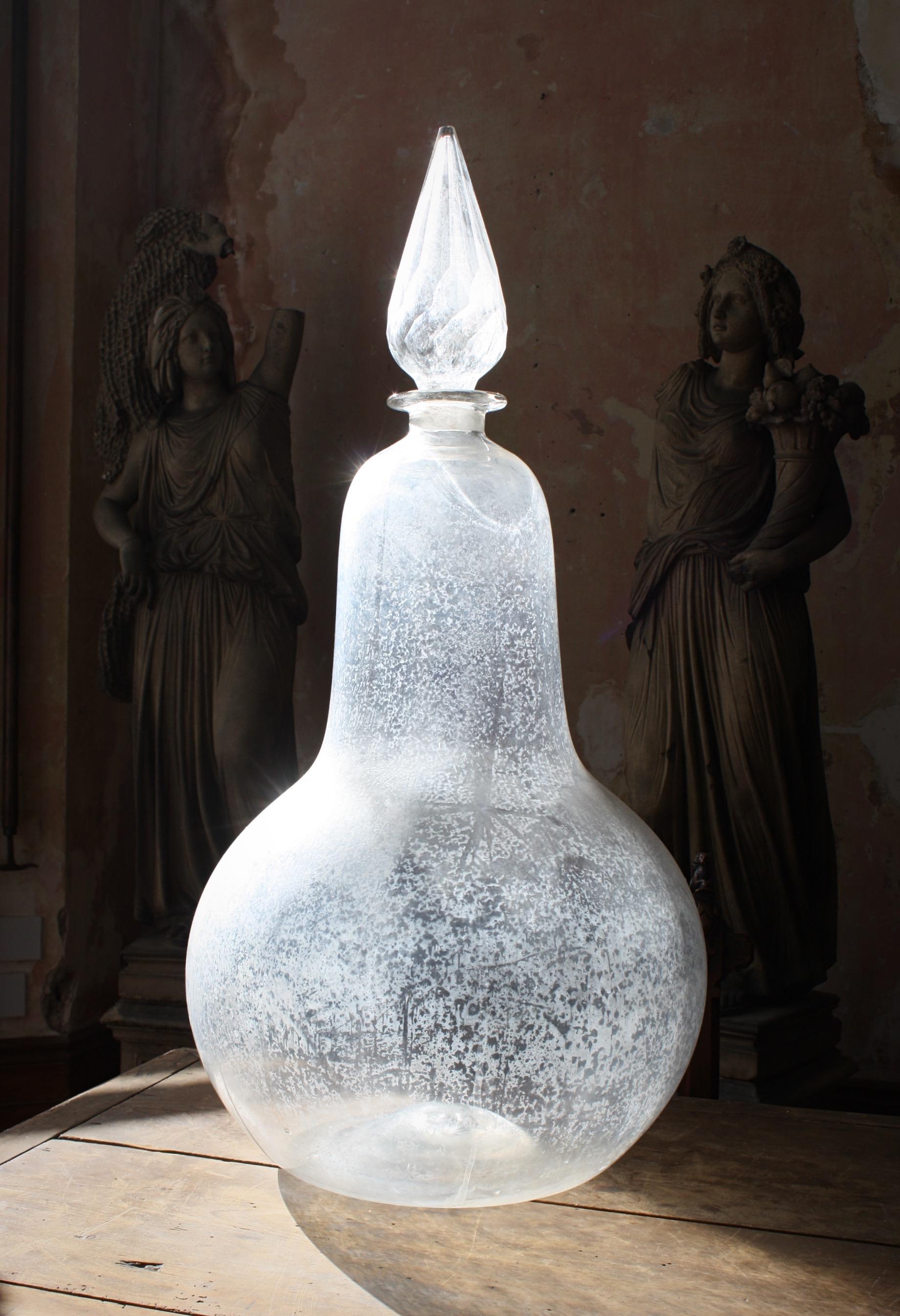 A 19th century hand blown glass chemist window display carboy. Used as a symbol of the pharmacy from the 17th century to the early 20th century. 

A rare example with a hollow cut glass stopper 

Measures: 85cm in height 
42cm in diameter.