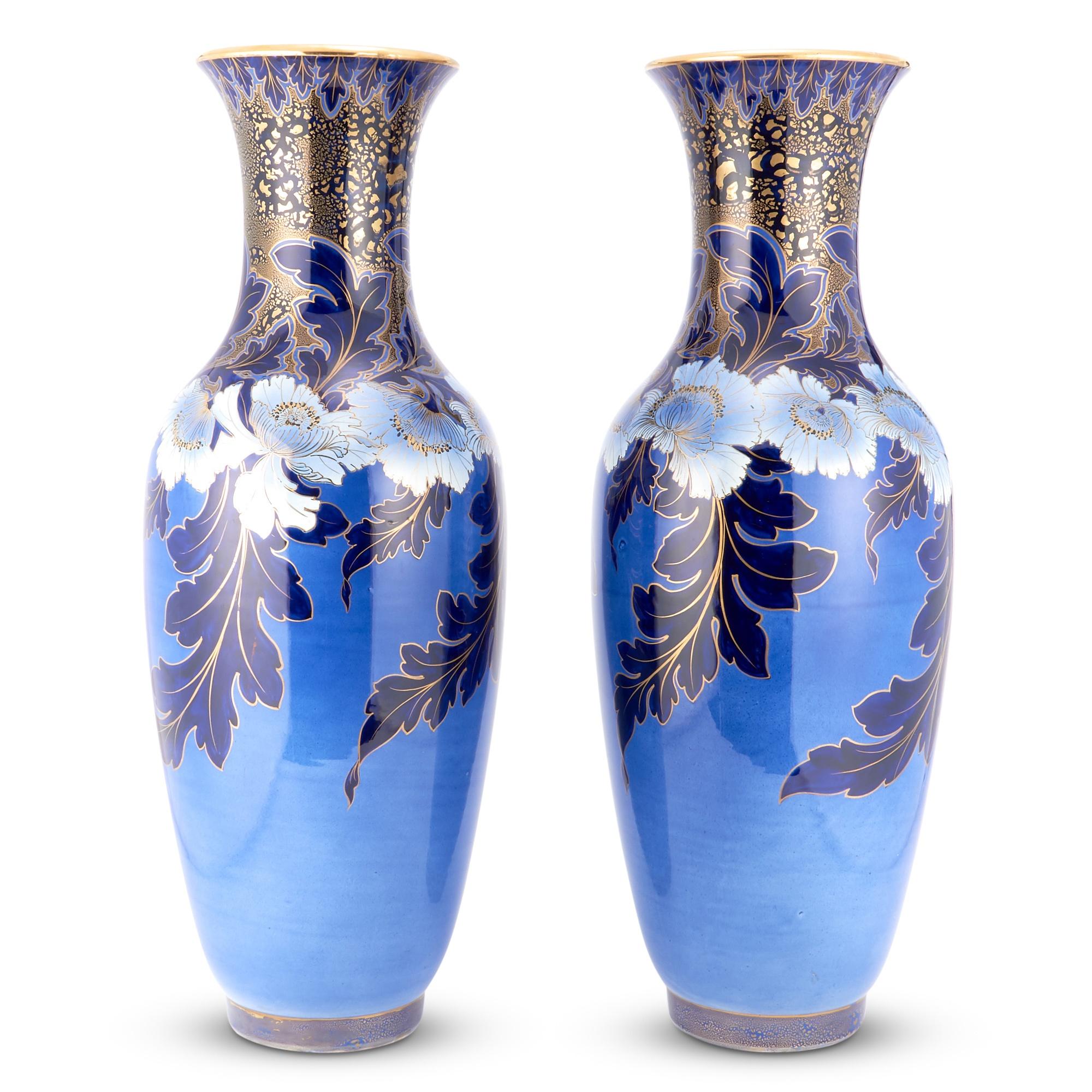 Immerse yourself in the opulence of the early 19th Century with this exceptional pair of Hand-Painted & Gilt Decorated Vases, a true testament to the craftsmanship of the era. Each vase is a masterpiece in its own right, boasting a large, tapered