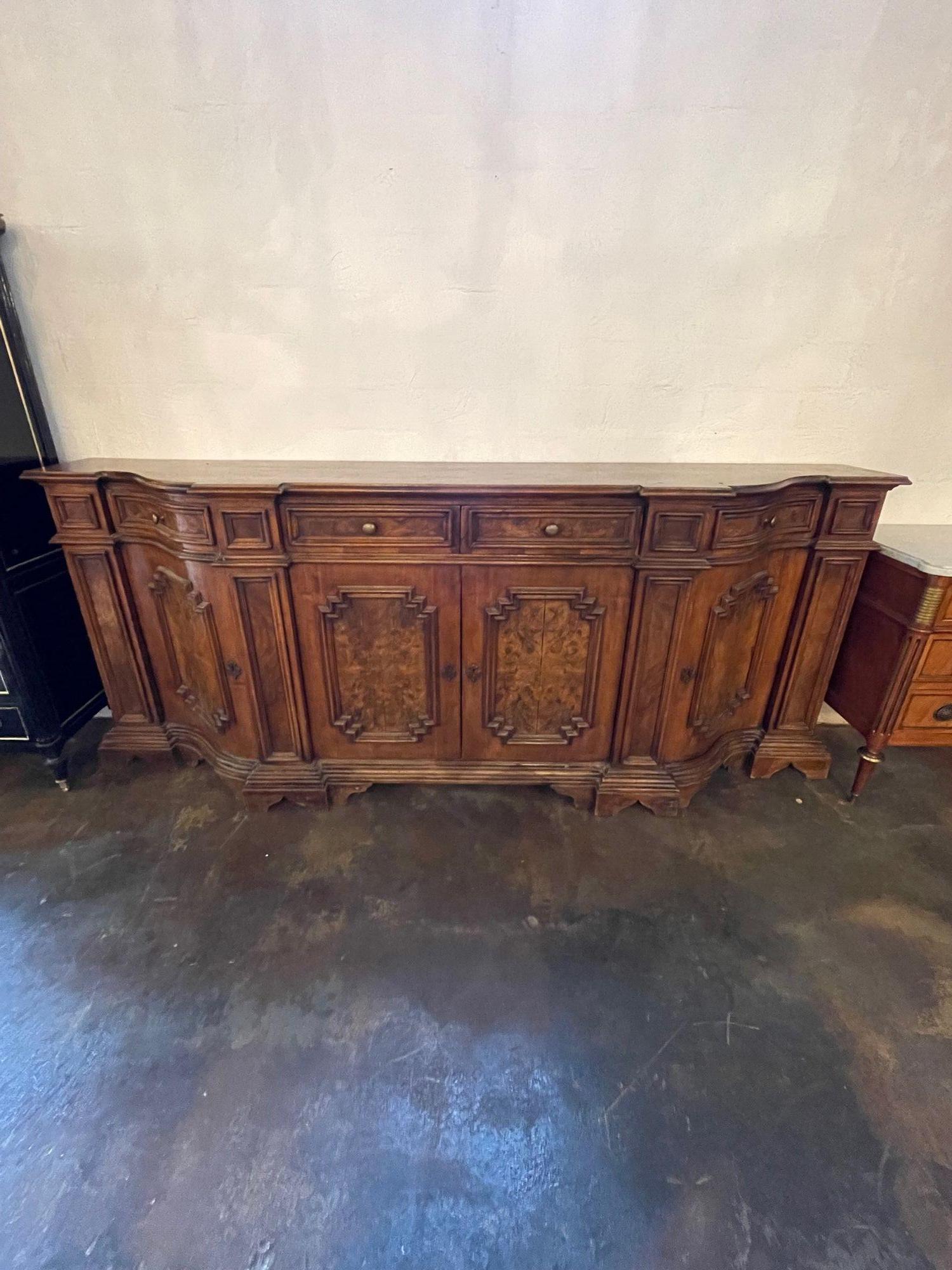 Very fine 19th century large carved Tuscan sideboard. Made of beautiful walnut with lovely carvings and tons of storage. An exceptional piece!