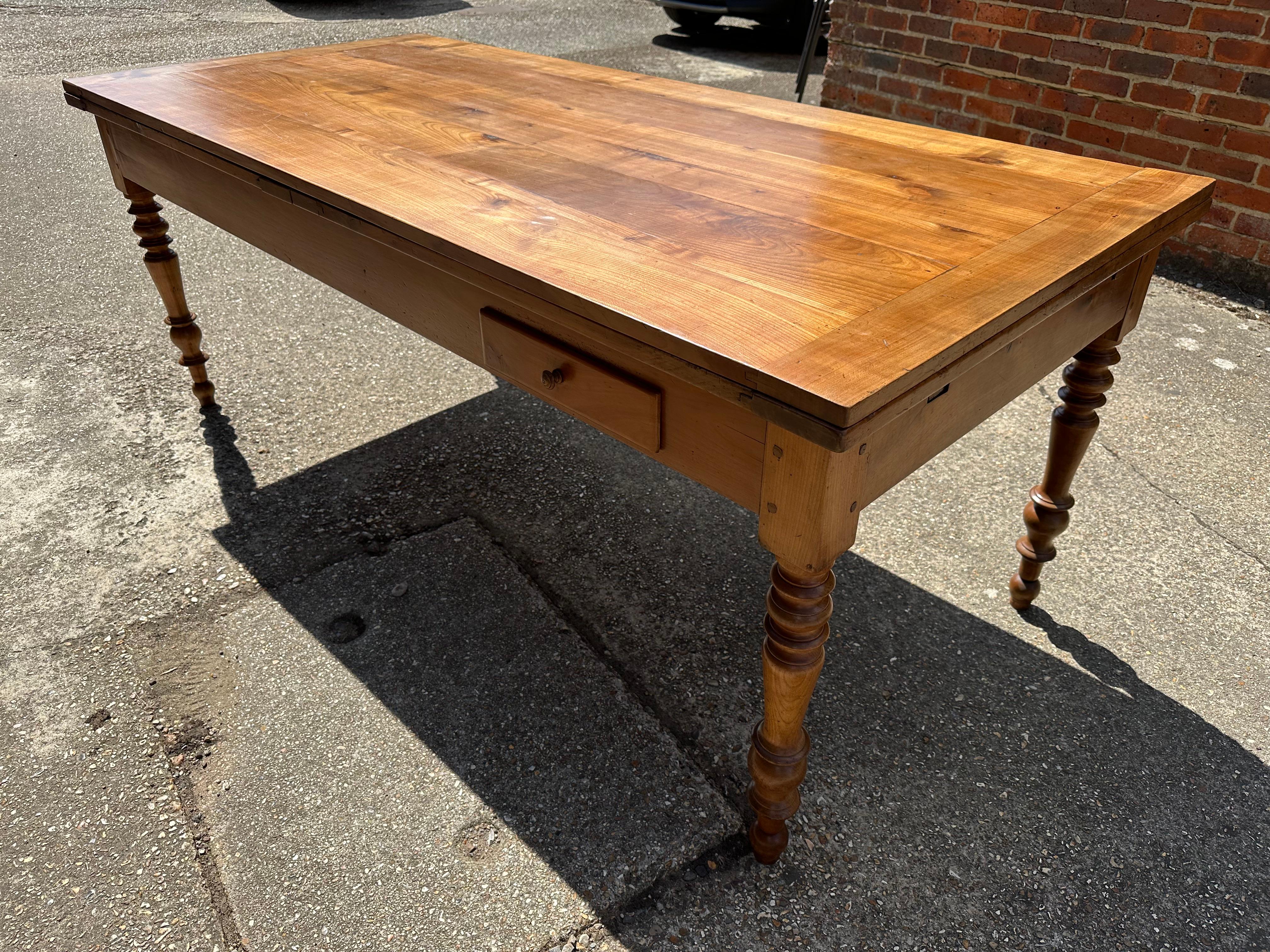 Hand-Crafted 19th Century Large Cherry Double Extending Farmhouse Table With One Side Drawer For Sale