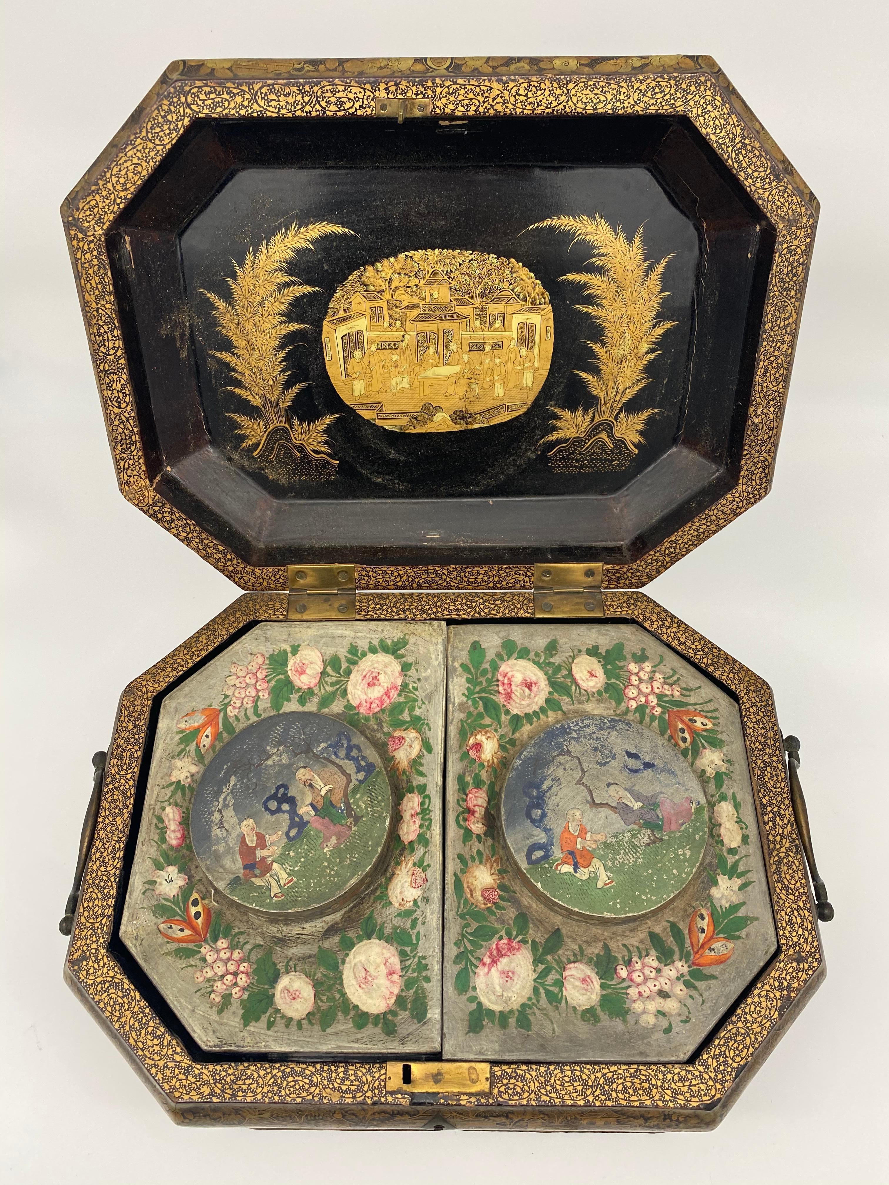 Large 19th century antique Chinese export gilt lacquer tea caddy with original painted tin inserts. Black lacquer with gilt design of foliage, figurative scenes, etc. Octagonal shape with original heavy zinc or tin inserts, each having their