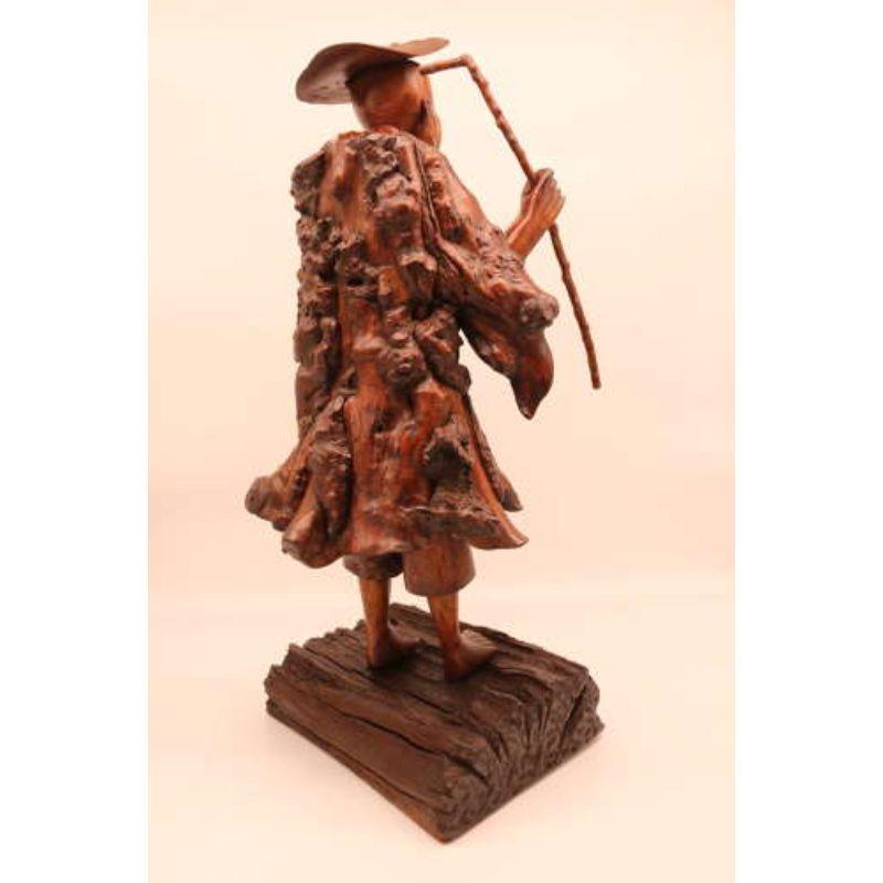 19th century large Chinese Wood root carving, circa 1870

This fascinating and highly tactile Chinese burr root wood carved sculpture depicts an elderly scholar. It is made from numerous individual pieces of selected natural burr root wood which