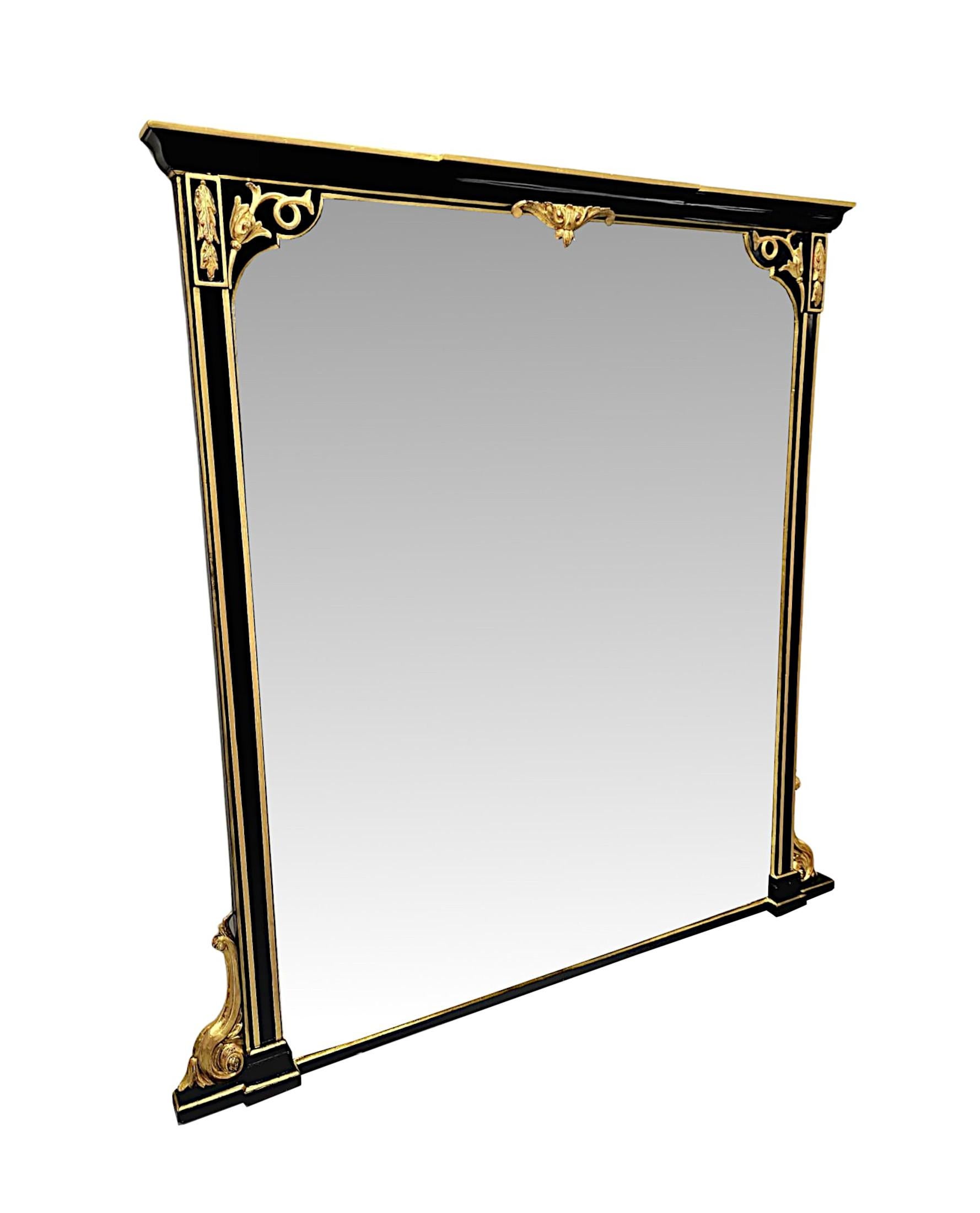 A very rare and fine 19th Century gilded and ebonised overmantel mirror of exceptional quality and large proportions.  The shaped mirror glass plate of rectangular form is set within a finely hand carved moulded, fluted and gilded frame with