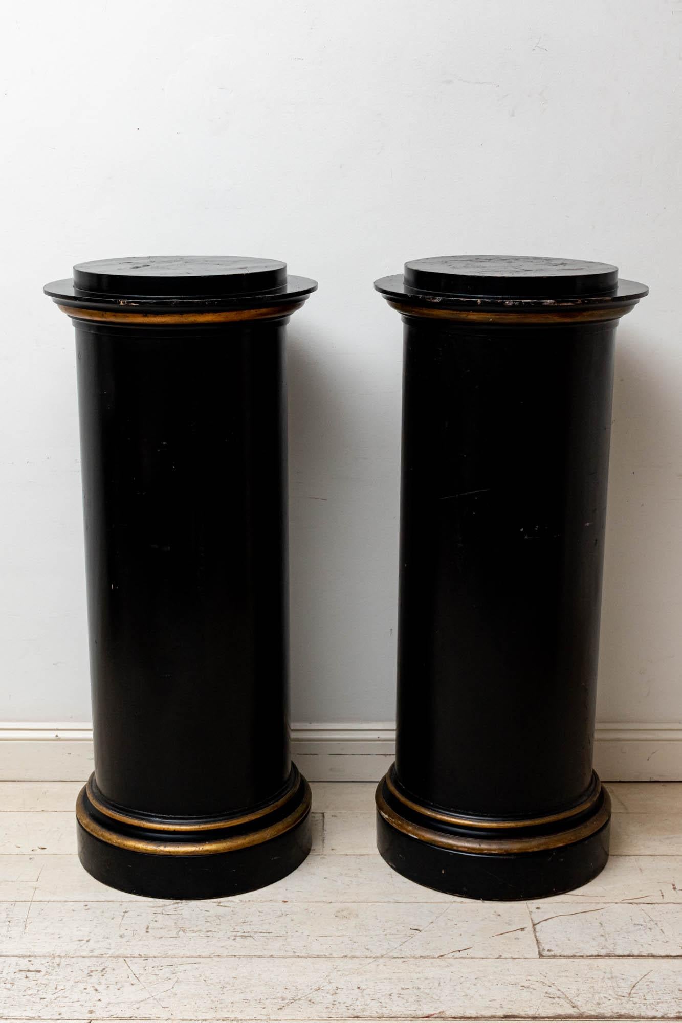 Early 19th century large pair of fabulous grand English Country House round columns with aged gilt border detailing around the top and the base. Very solid and stable and built to heavy objects such as marble busts, figure and statues. The columns