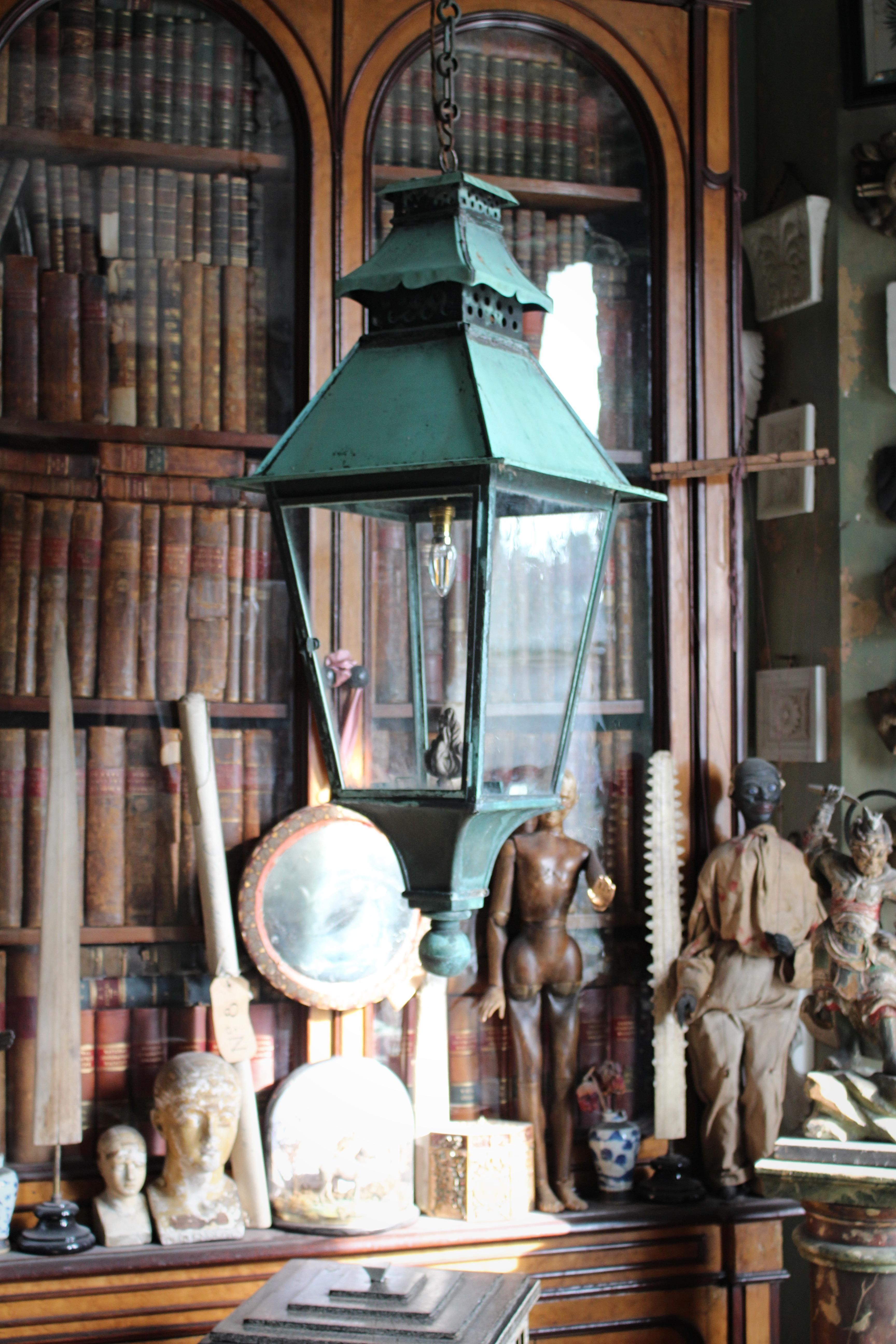 A large copper and glazed Victorian exterior lantern, with the finest original verdigris surface.

Sheet and formed copper structure of typical form with a unusual pagoda finial, a later period style hanging hoop

Would be been originally been gas,