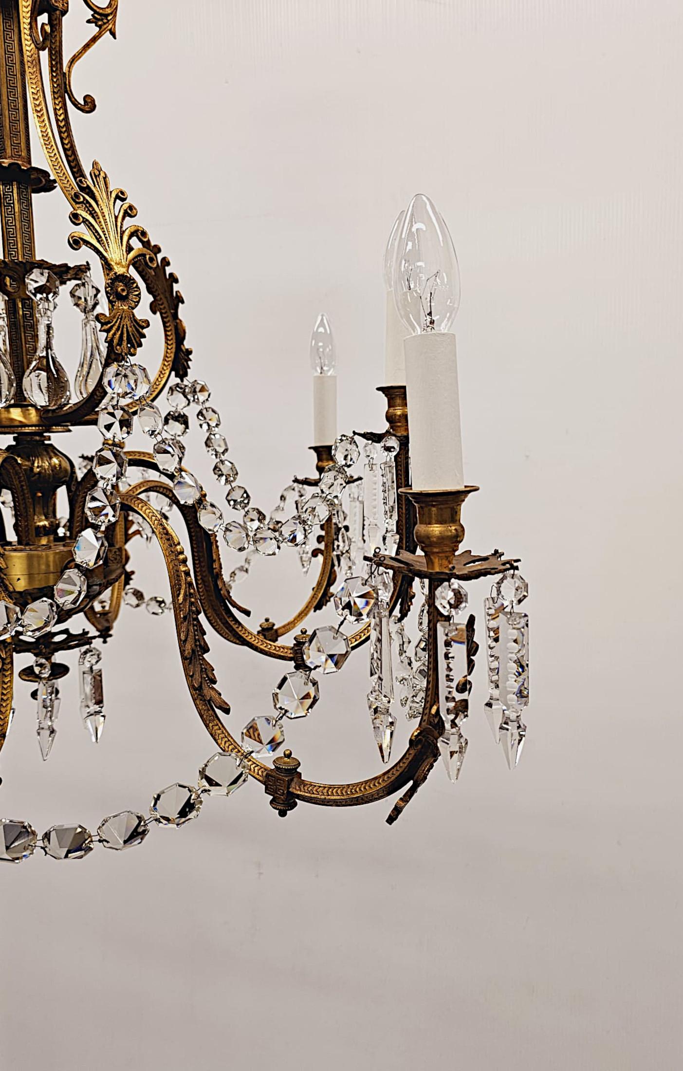 A very rare 19th Century French rewired gilt bronze and crystal eight branch gasolier of grand proportions and exceptional quality.  This stunning well cast gilt bronze piece features an ornate Greek Key decorated sextagonal central column