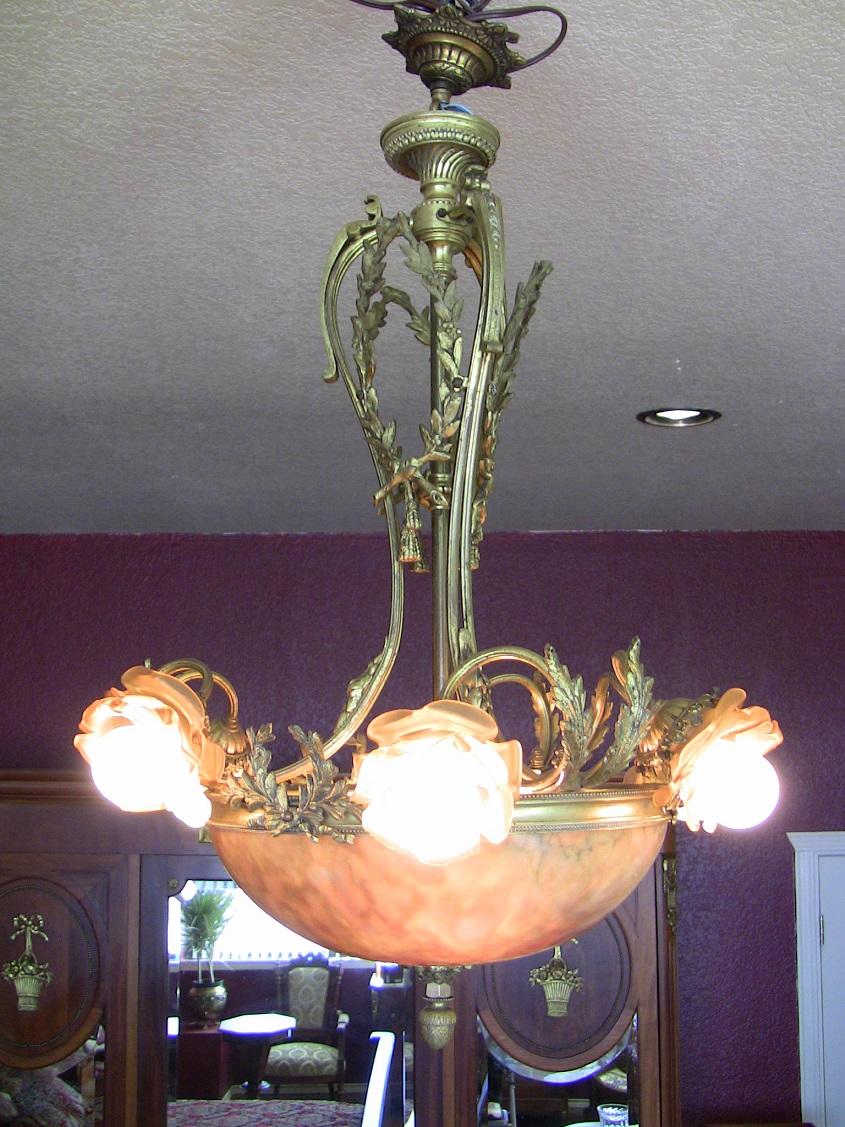 Absolutely gorgeous 19th century French chandelier in the Louis XVI style.
Ormolu and brass central columns and supports. Central column surrounded by three laurel wreaths.
Three sheafs of wheat top the shade. Large alabaster shade with