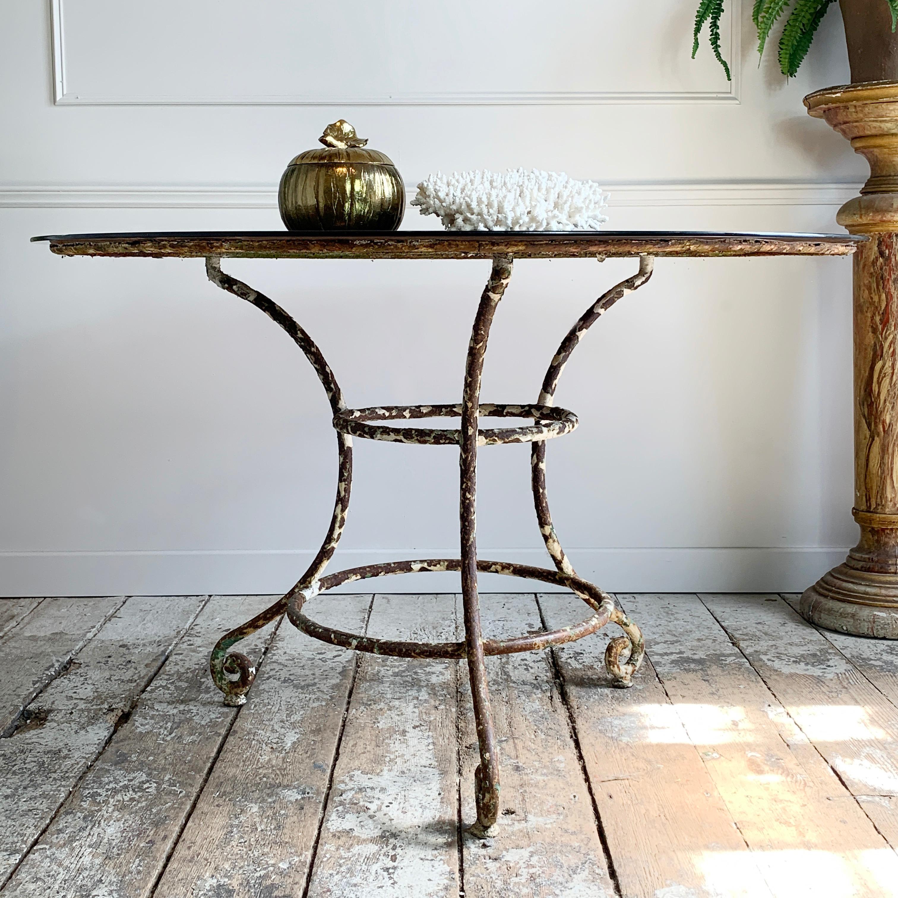 vintage wrought iron table with glass top