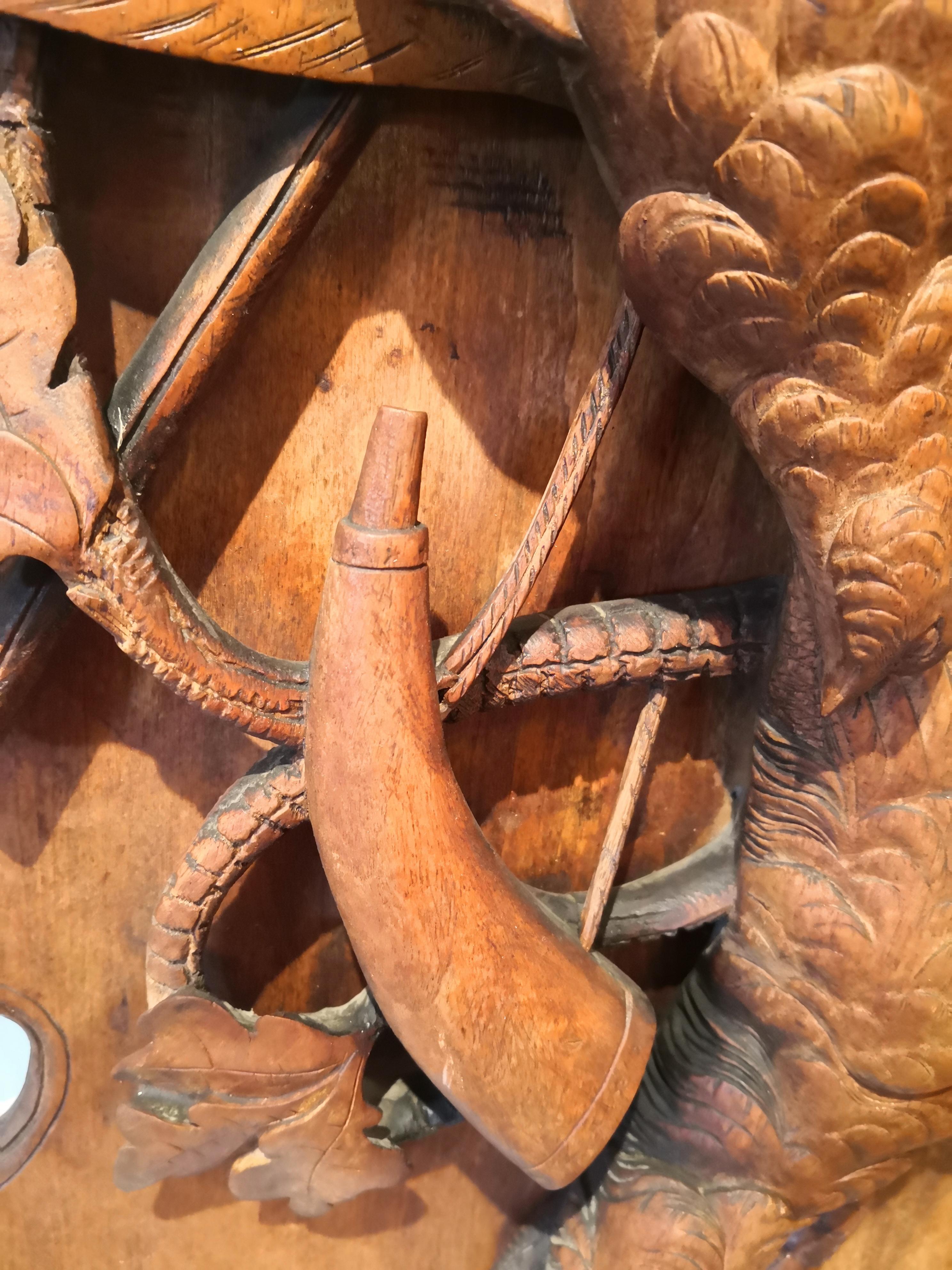 Very large German wooden plaque hand carved in basswood in German Black Forest style. About 1880. The hunting plaque shows pheasants and oak leaves in a naturalistic detailed style. Backside signed W. Voigt and dated 1912. Some minor losses.