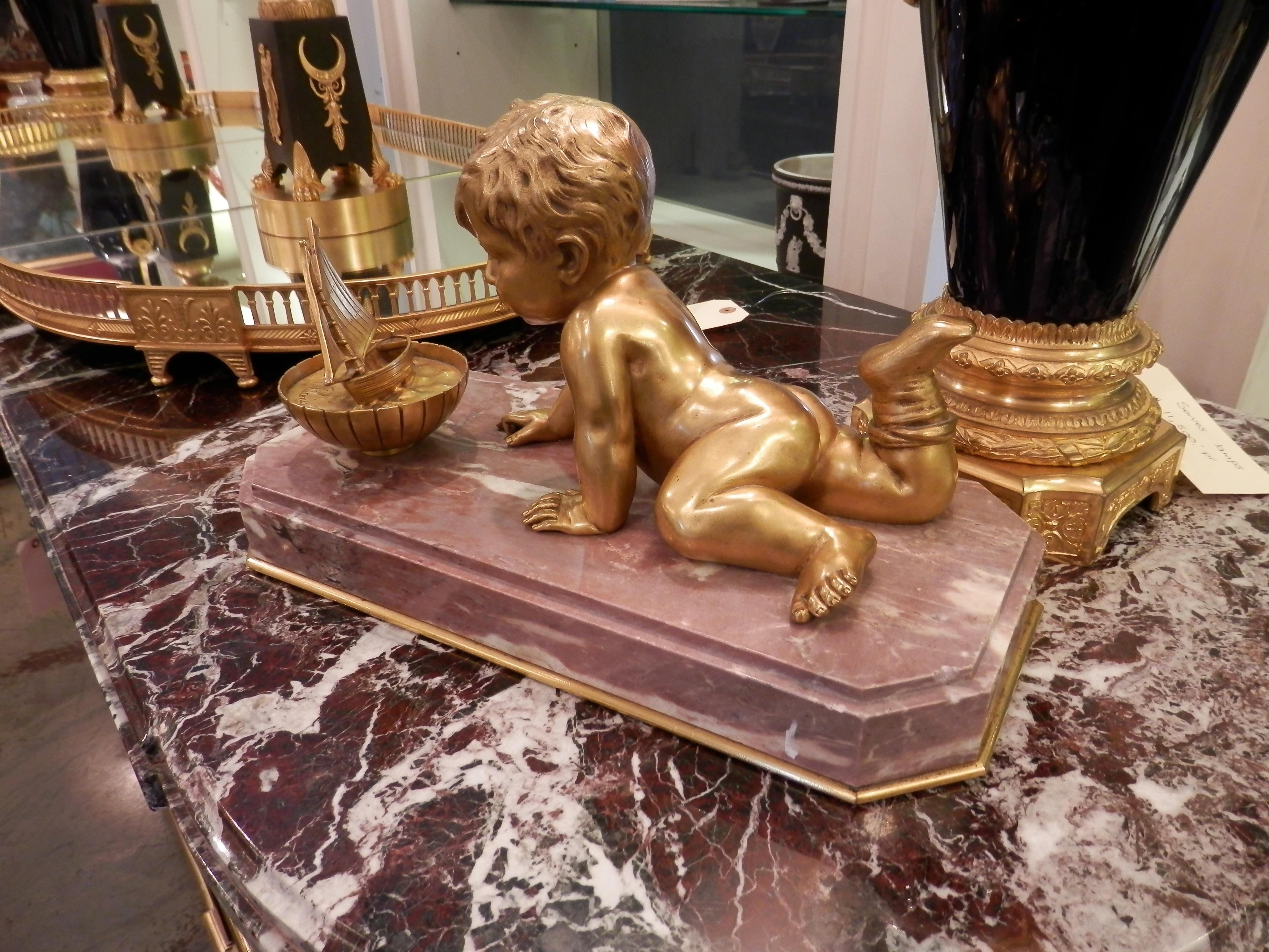 Louis Philippe 19th Century Large Gilt Bronze Cherub Playing with His Toy Boat on a Marble Base For Sale