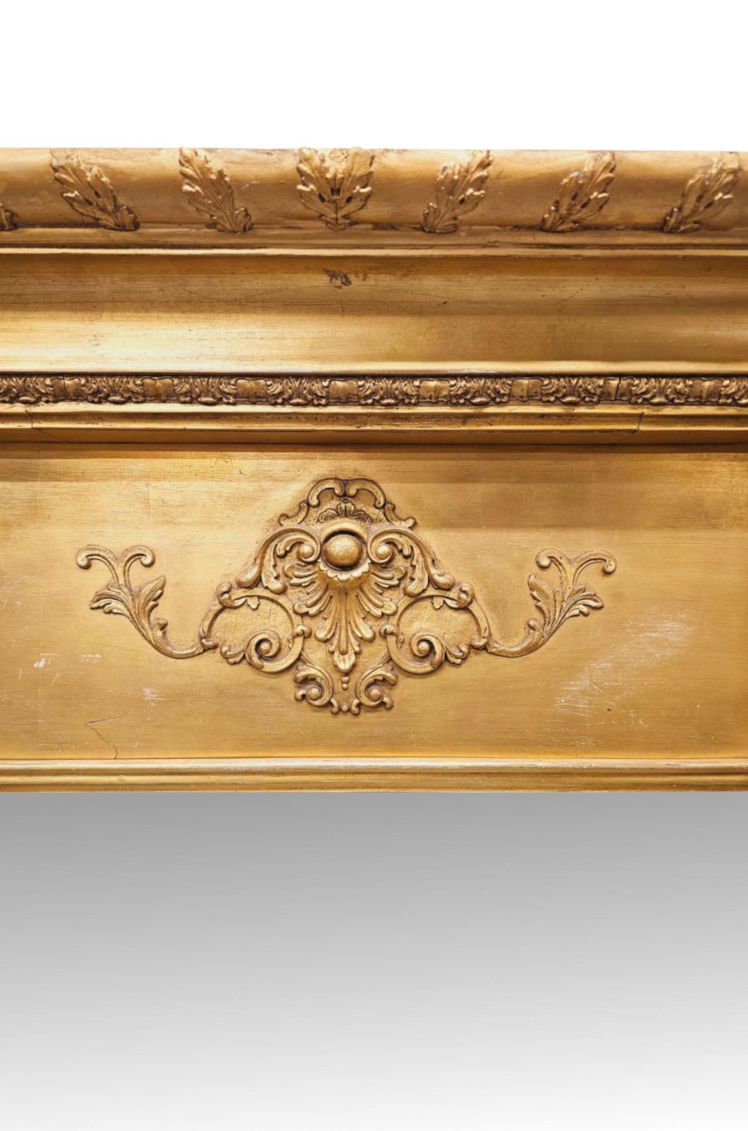 A very fine 19th Century giltwood dressing or leaner mirror of grand proportions and exceptional quality.  The mirror glass plate of rectangular form is set within a stunningly hand carved, moulded and fluted giltwood frame surmounted with an