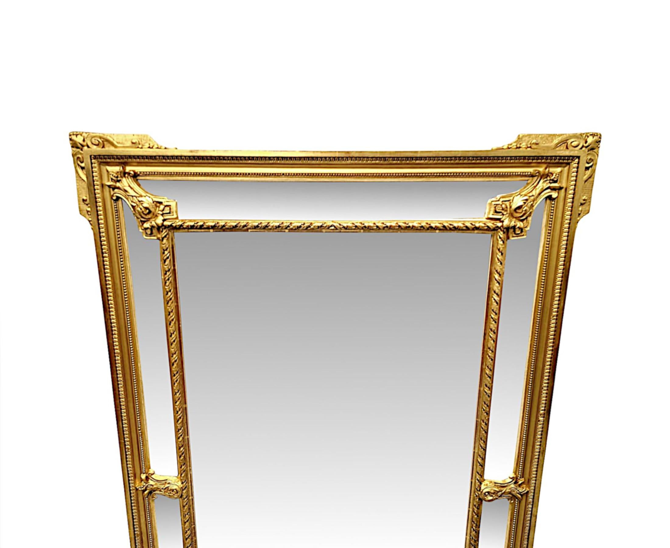 A very fine 19th Century giltwood margin overmantel or hall mirror of large proportions and superb quality.  The central mirror glass plate of rectangular form is bordered with an additional set of six mirror glass plates, all set within a
