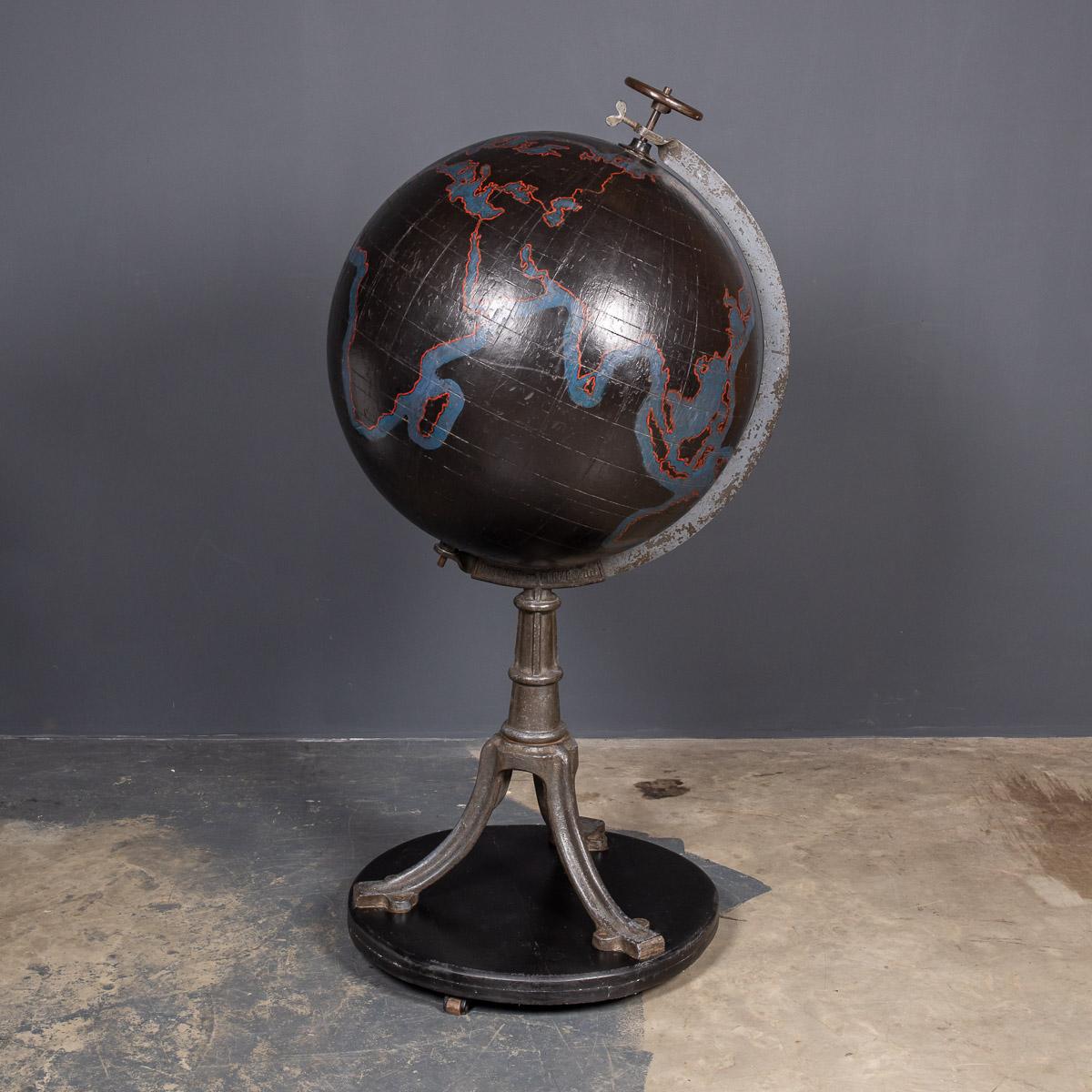 Antique 19th century Victorian large globe, painted black, previously used for educational purposes, with just the outline of continents and countries highlighted in red. Made by The Brussels National Institute of Geography, the globe is constructed