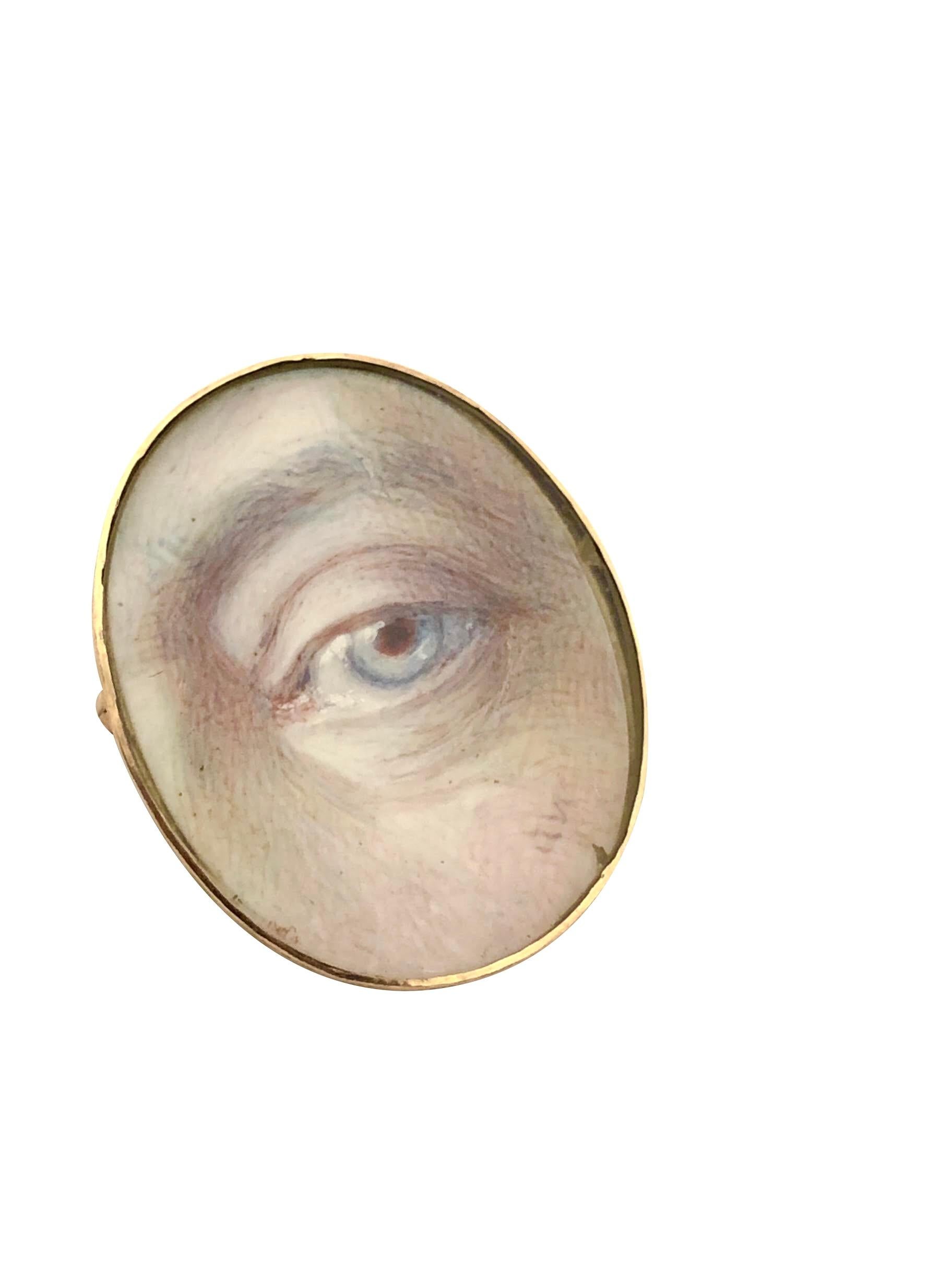 Circa 1880 - 1900 Lover's Eye Brooch Pendant, 12K Yellow Gold and Finely Painted Lover's Eye under glass featuring the Artists initials, this unusually larger piece measures 1 X 3/4 Inch, the perimeter of the frame has hand engraved design work,