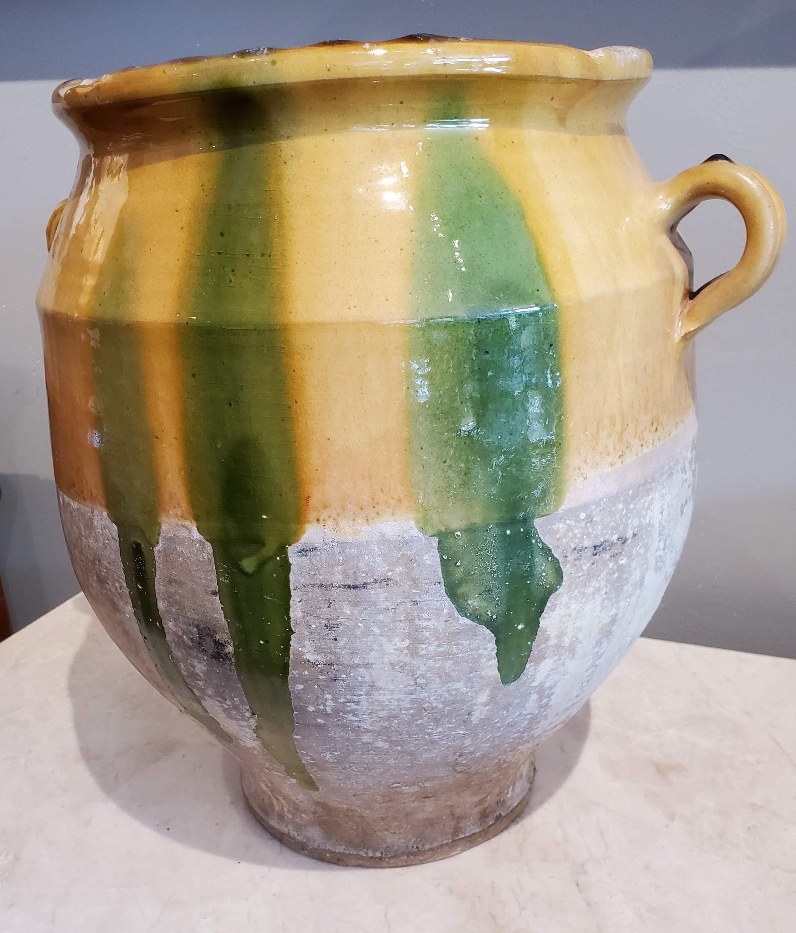 19th century large green glazed terracotta “Confit” pot. Once a staple in French kitchens, confit pots were popular to preserve and Cook duck before refrigeration existed. 
Provence, circa 1880
Measures: 12.5
