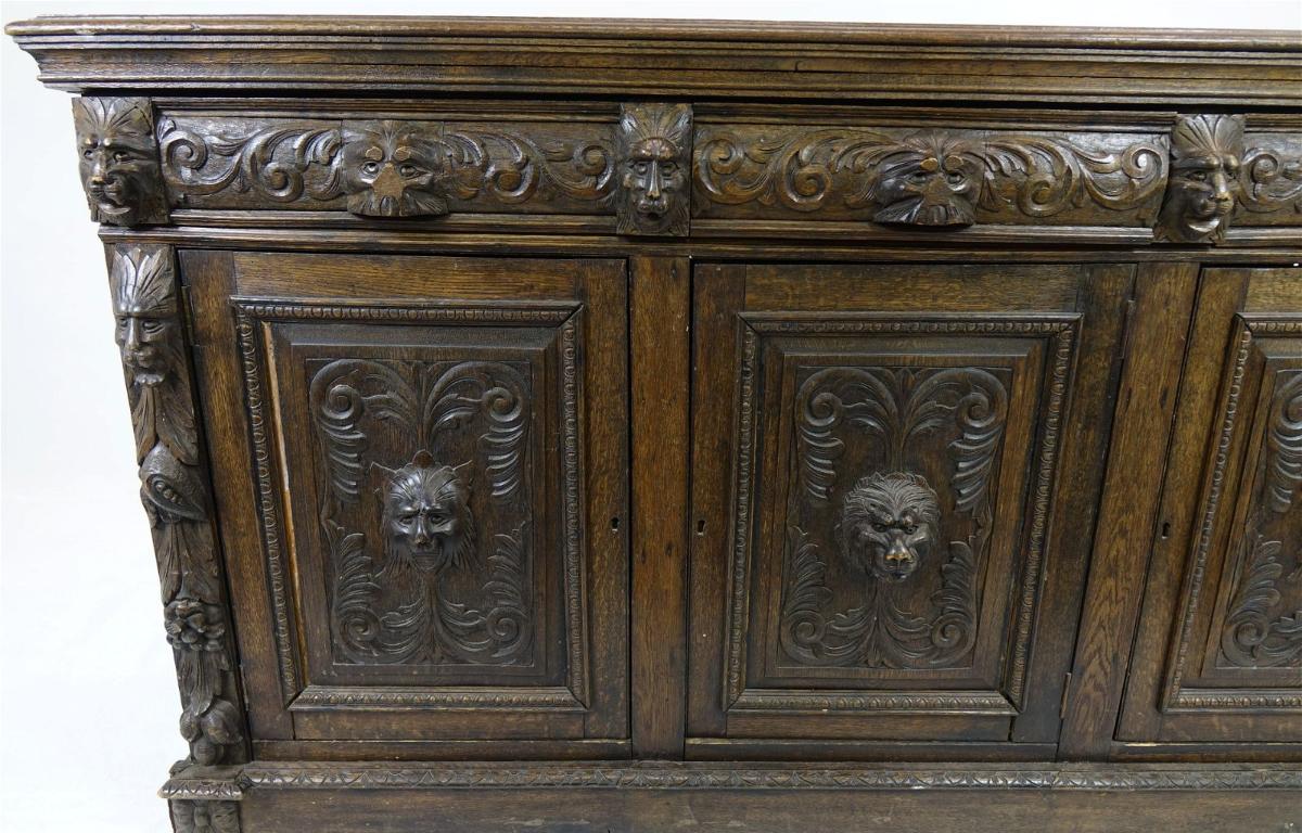 19th Century Large Heavily Carved Gothic Revival Sideboard. Very beautifully done. The top is in solid wood and has a gap between the boards. Dimensions: 71.5