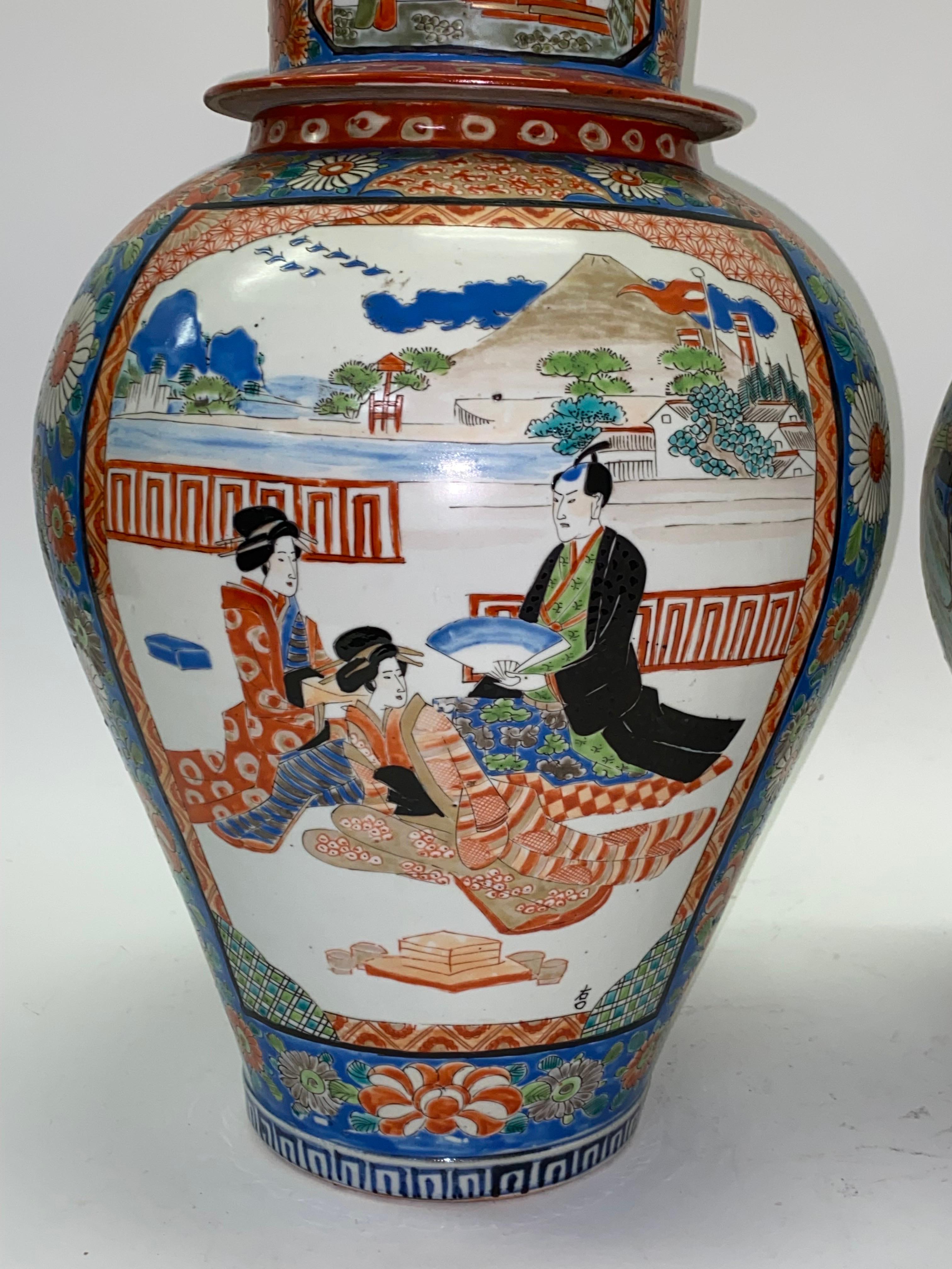 A large and very fine condition pair of antique Japanese Imari Ginger jars from the second half of the 19th century. Each is 12 inches in diameter and 19 inches tall. The colors are rich and the pieces are impressive. Inside the jars the previous