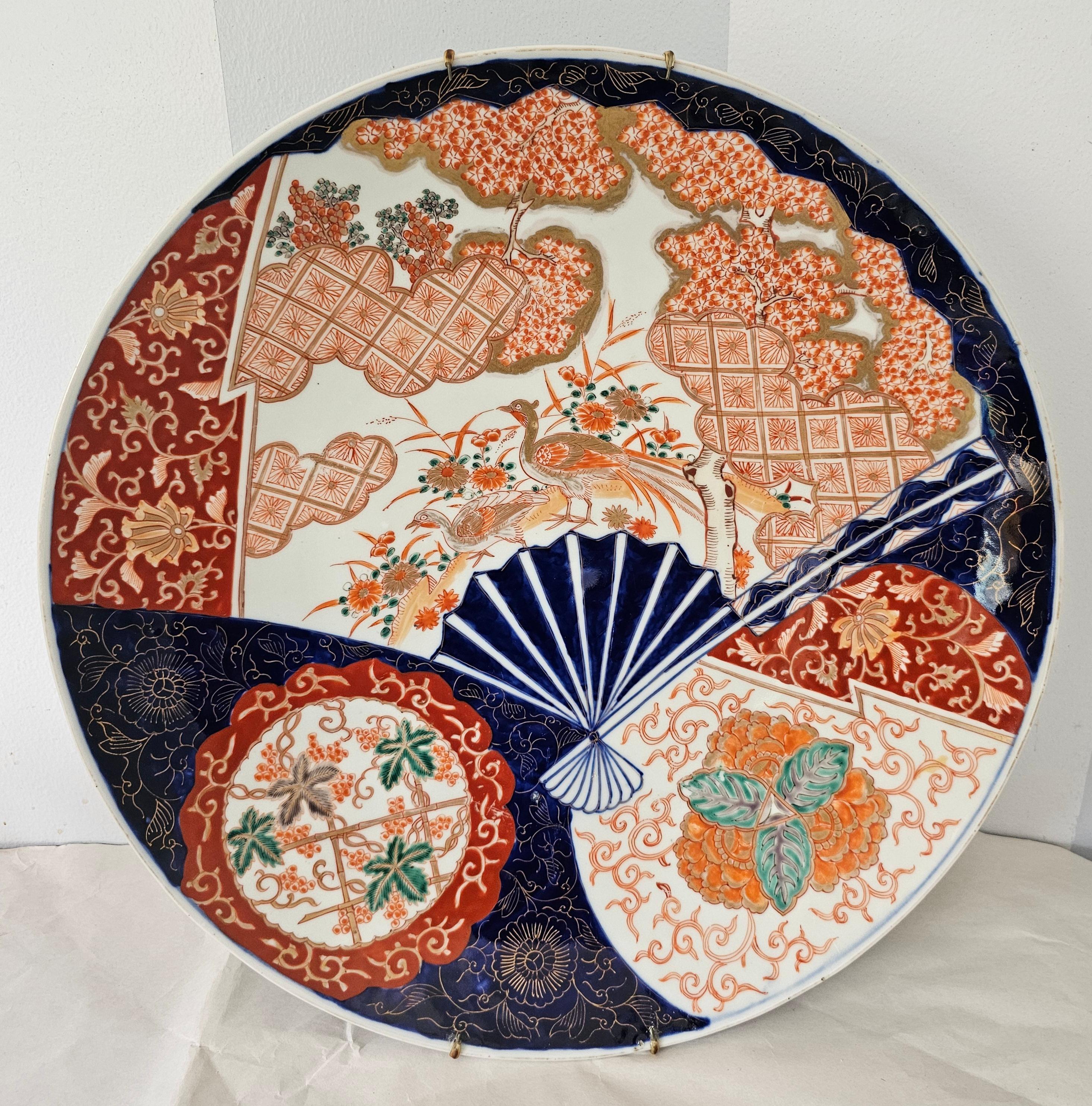 A 19th Century Large Japanese Imari Decorative Platter in great antique condition. Ready to hang or stand . Measures 16