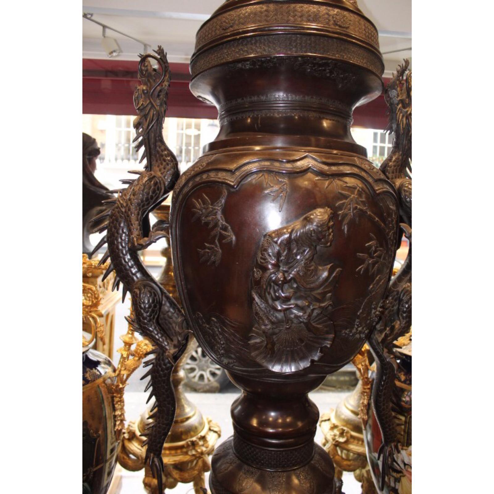 An impressive 240cm x 83cm piece! It is available to view at our shops location if wanting to see it in person. 
It is beautiful decorated with dragons on the sides of the vase, and a magnificent eagle at the top.
The piece is able to come apart