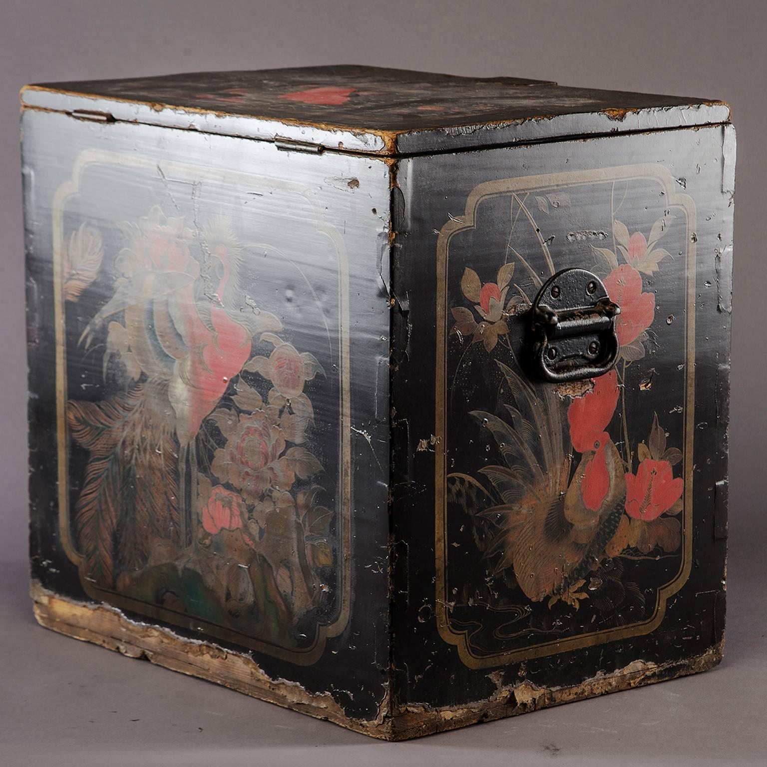 Large wooden Japanese store display tea box, circa 1880s. All original finish with black back ground and decorative flowers, vines and birds, and a peacock in red and gold. Visible wear to finish and edges. Original hardware. Lettering/writing on