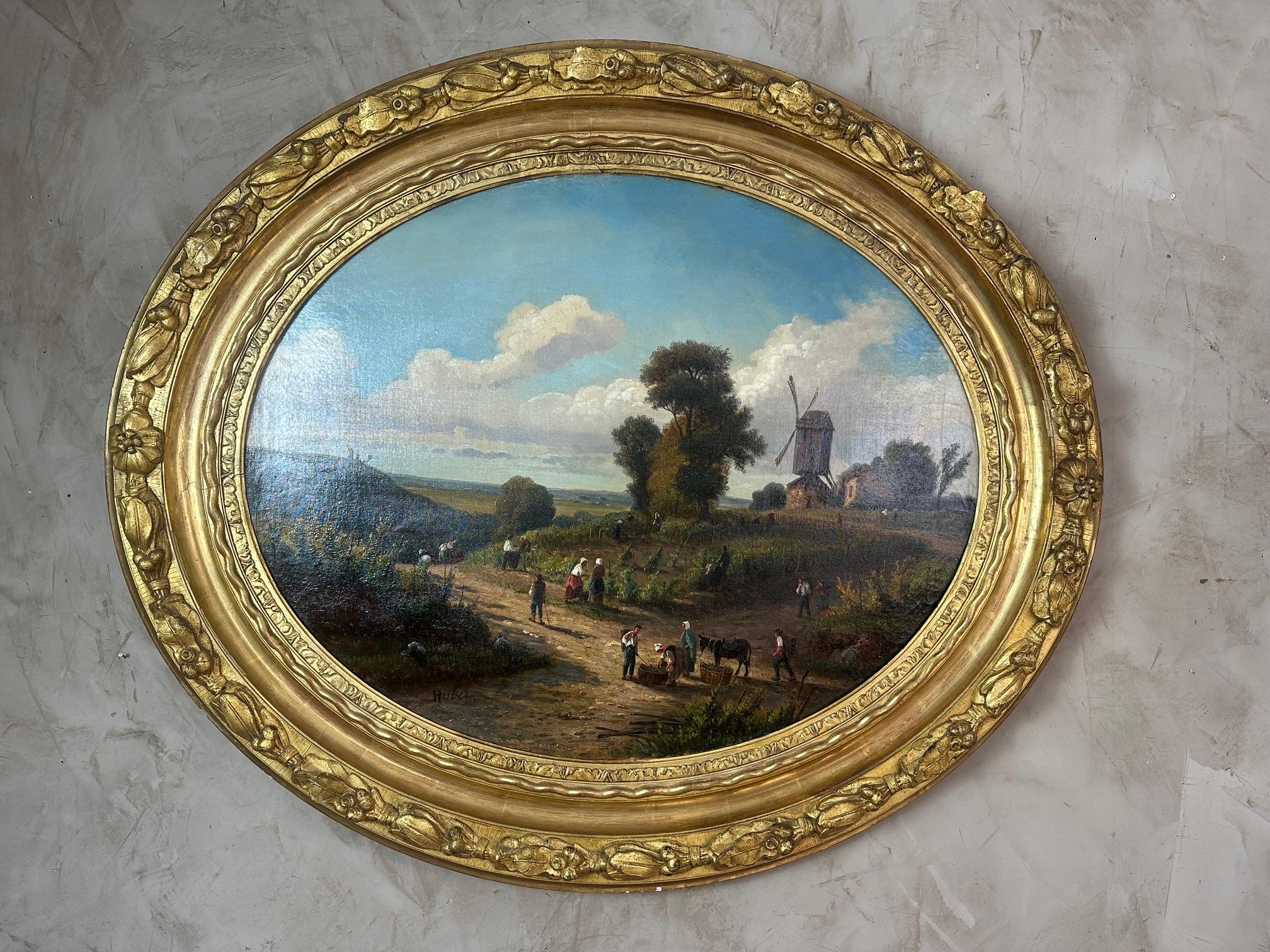 Très beau tableau ovale, huile sur toile dans son cadre en bois d'origine datant du 19ème siècle et signé Hubert en bas à gauche. 
Peintre probablement hollandais ou allemand. Scène de récolte avec un moulin à l'arrière-plan.
Provient d'une belle
