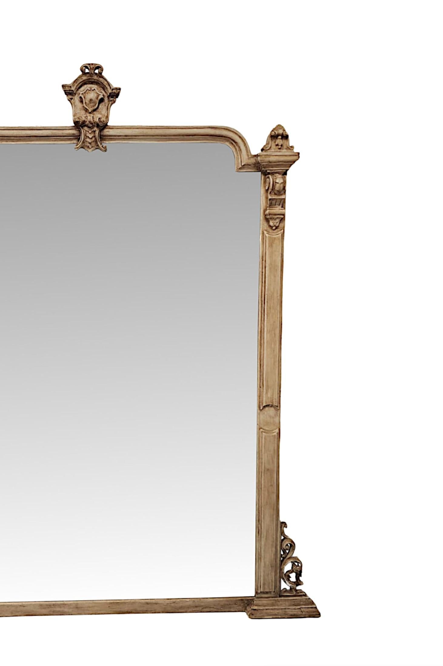 A fabulous and unusual 19th Century overmantel mirror of exceptional quality, grand proportions and in excellent condition.  The mirror glass plate of shaped rectangular form is set within a stunningly hand carved, moulded and fluted wooden frame