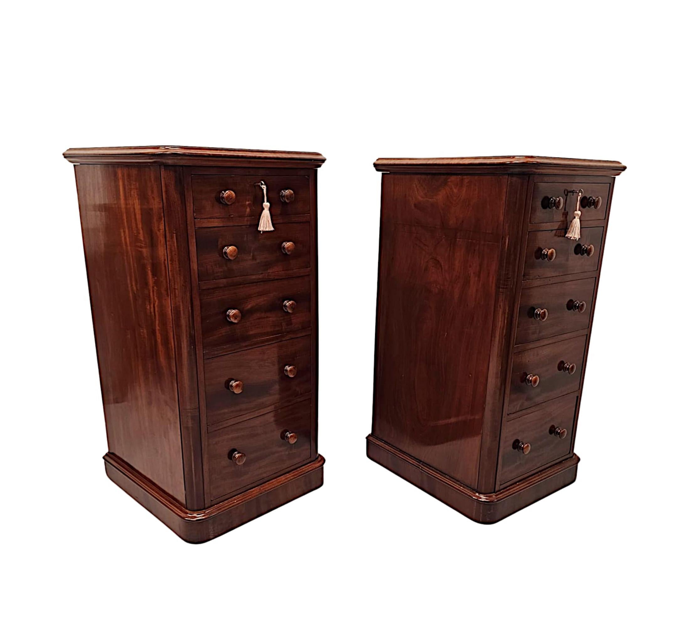 A gorgeous pair of 19th Century mahogany bedside chests of large proportions, finely hand carved and of exceptional quality with rich patination and beautiful grain.  The well figured moulded top of rectangular form is raised over five graduated