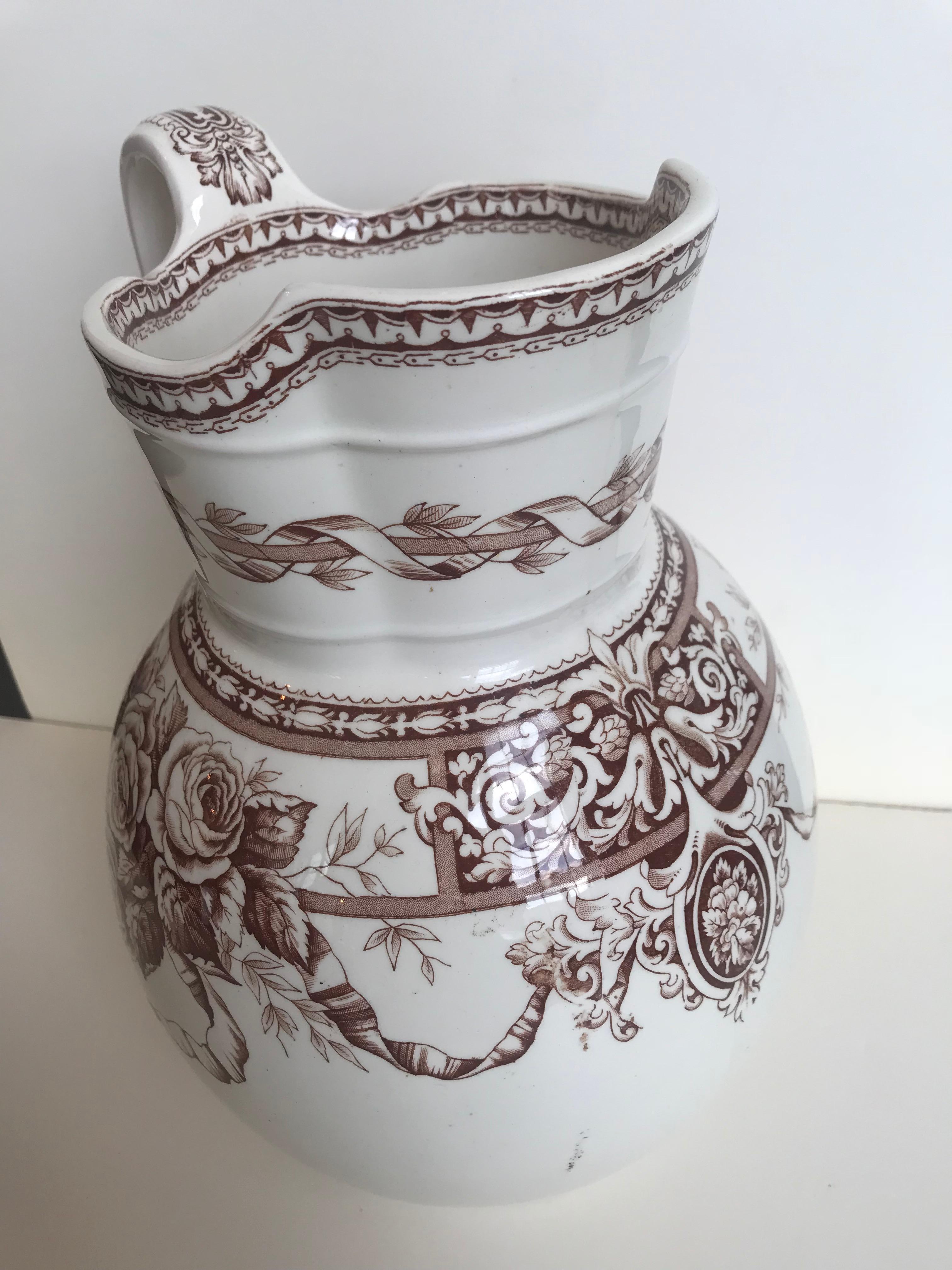 19th century large scale floral ribbon English ironstone pitcher. Marked T. Furnival & Sons, Sharon. 

 