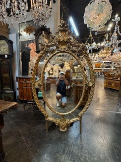 19th Century Large Scale French Oval Carved and Giltwood Mirror