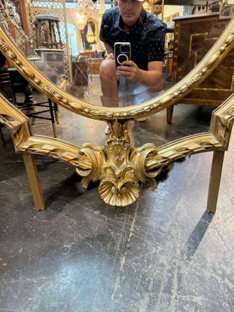 Specchio francese ovale intagliato e in legno dorato del XIX secolo di grandi dimensioni in vendita 4