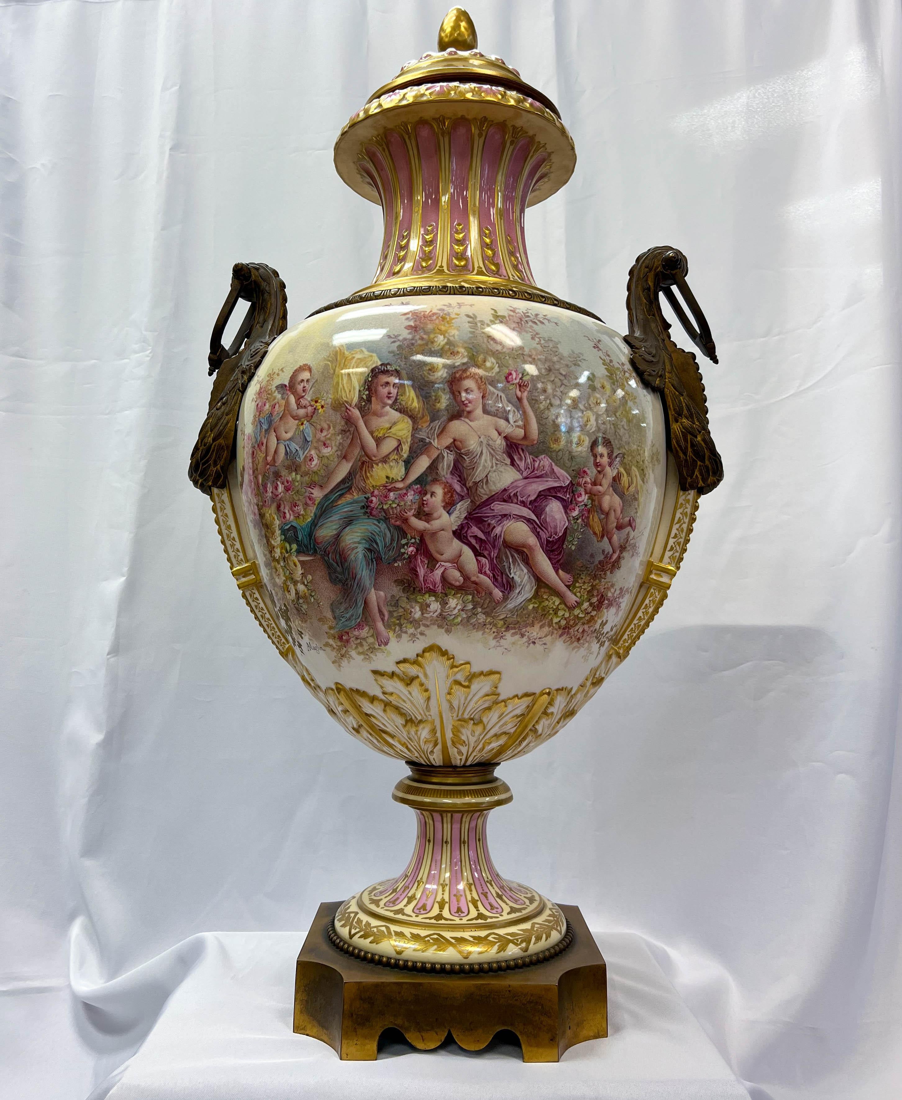 A palatial 19th Century French ormolu mounted Sèvres urn, exemplifying the elegant Neoclassical style crafted from the finest hard-paste porcelain, also known as 
