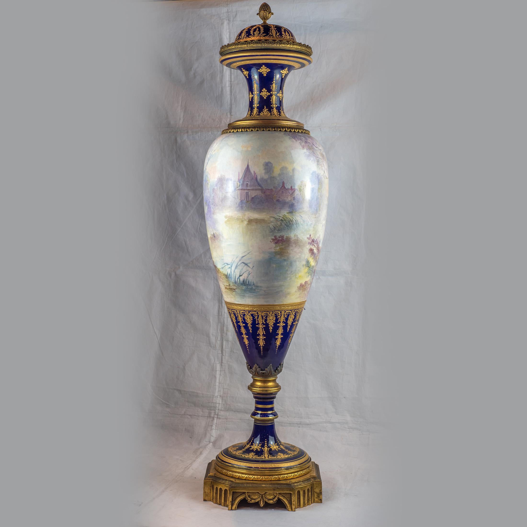 A magnificent large Sèvres-style gilt bronze mounted cobalt blue ground porcelain lidded vase.

Origin: French
Date: 19th century
Dimension: 42 inches high.