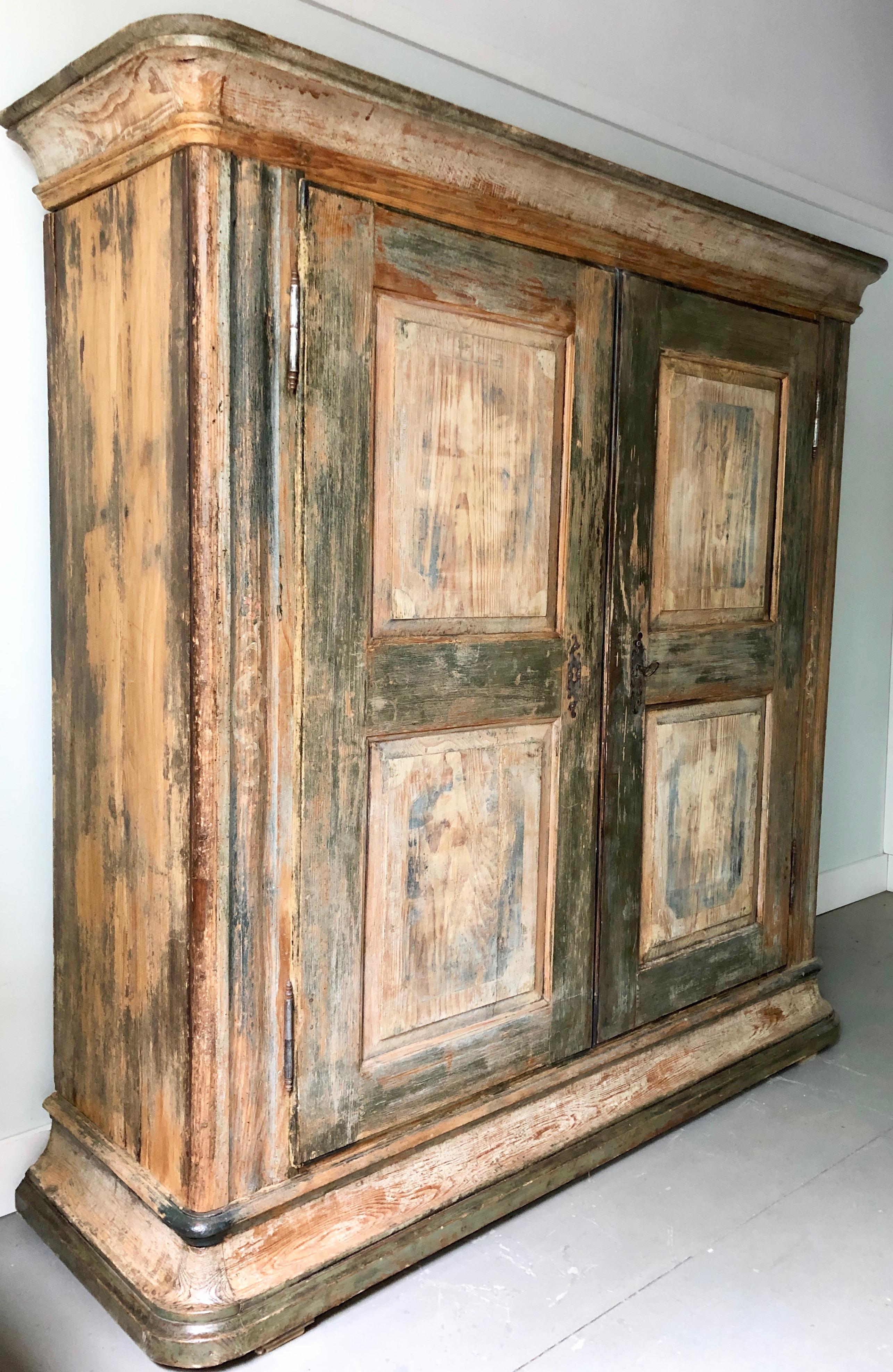 A large, handsome 19th century Swedish armoire/cabinet with two paneled doors and original hardware’s.
Outside paint in original blue patina and inside in natural pine with multiple shelves providing for amble storage.
Sweden, circa 1860.