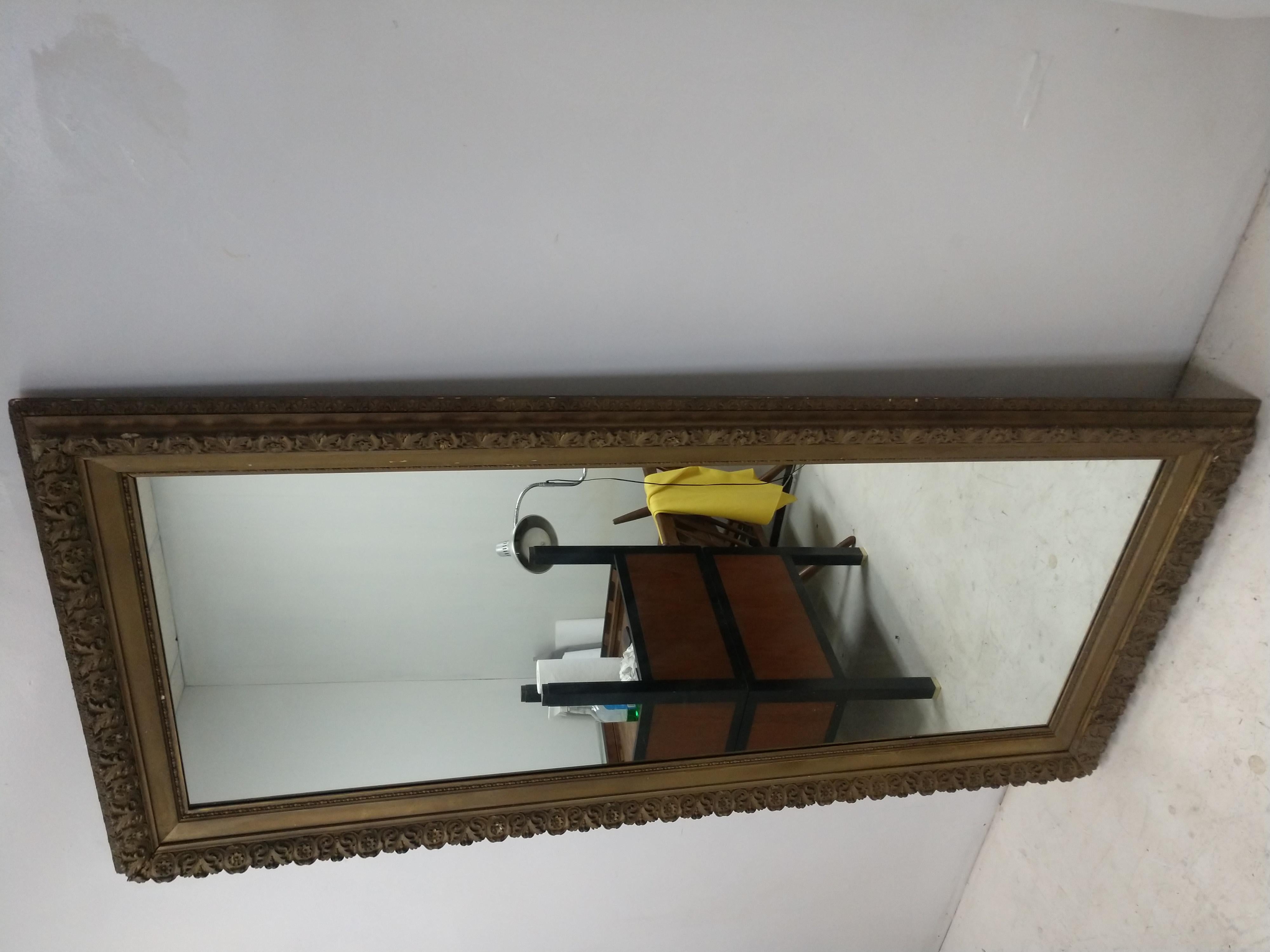 Tall gesso mirror with a new 1/4 plate mirror. Gesso frame in very good antique condition with minimal wear considering the age.