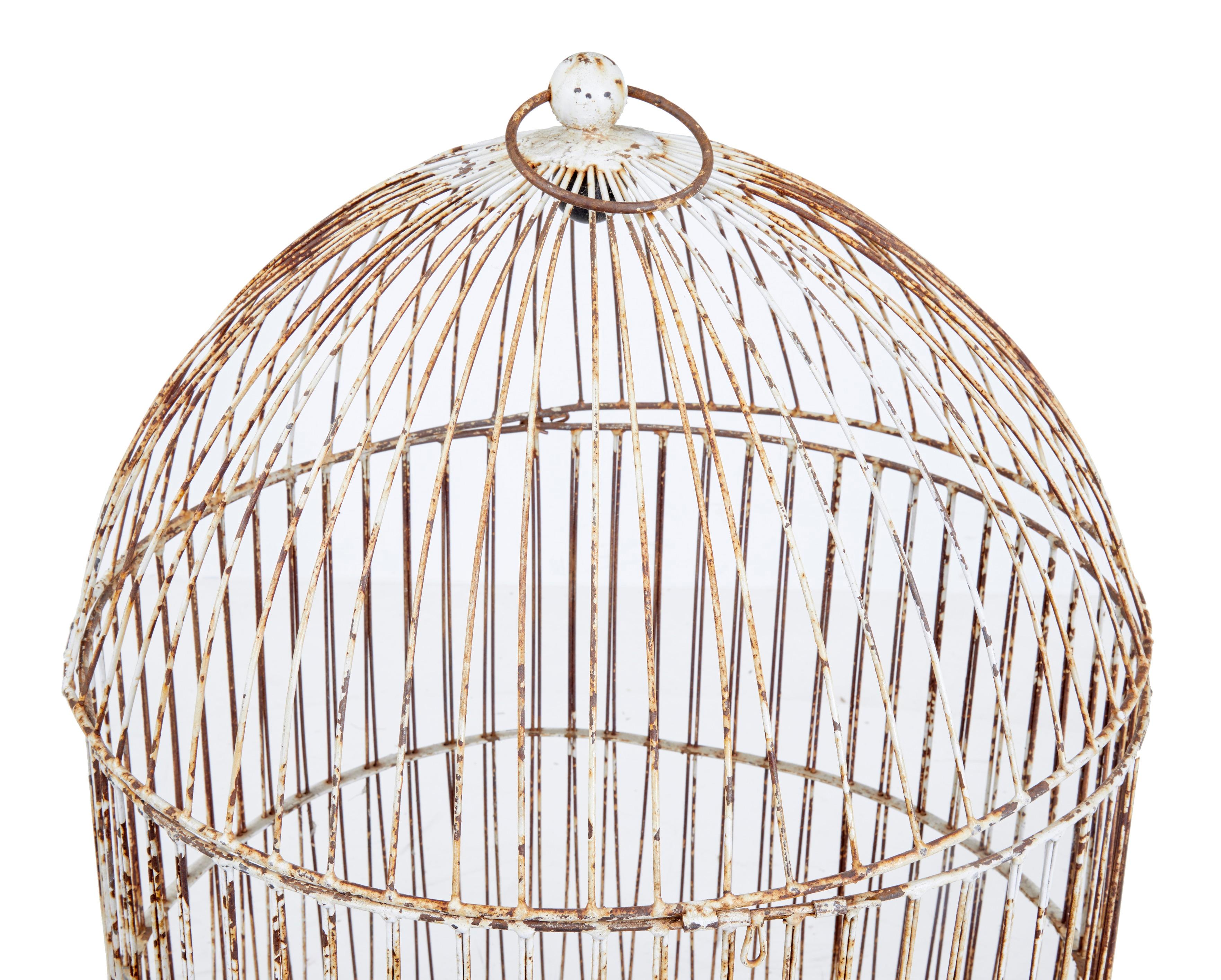 19th century large wire frame decorative bird cage, circa 1890.

Large wire frame parrots cage.

2 parts, with removable dome top with bull ring fitment. No fittings included. Ideal decorative piece. Will need some work to get the dome top to