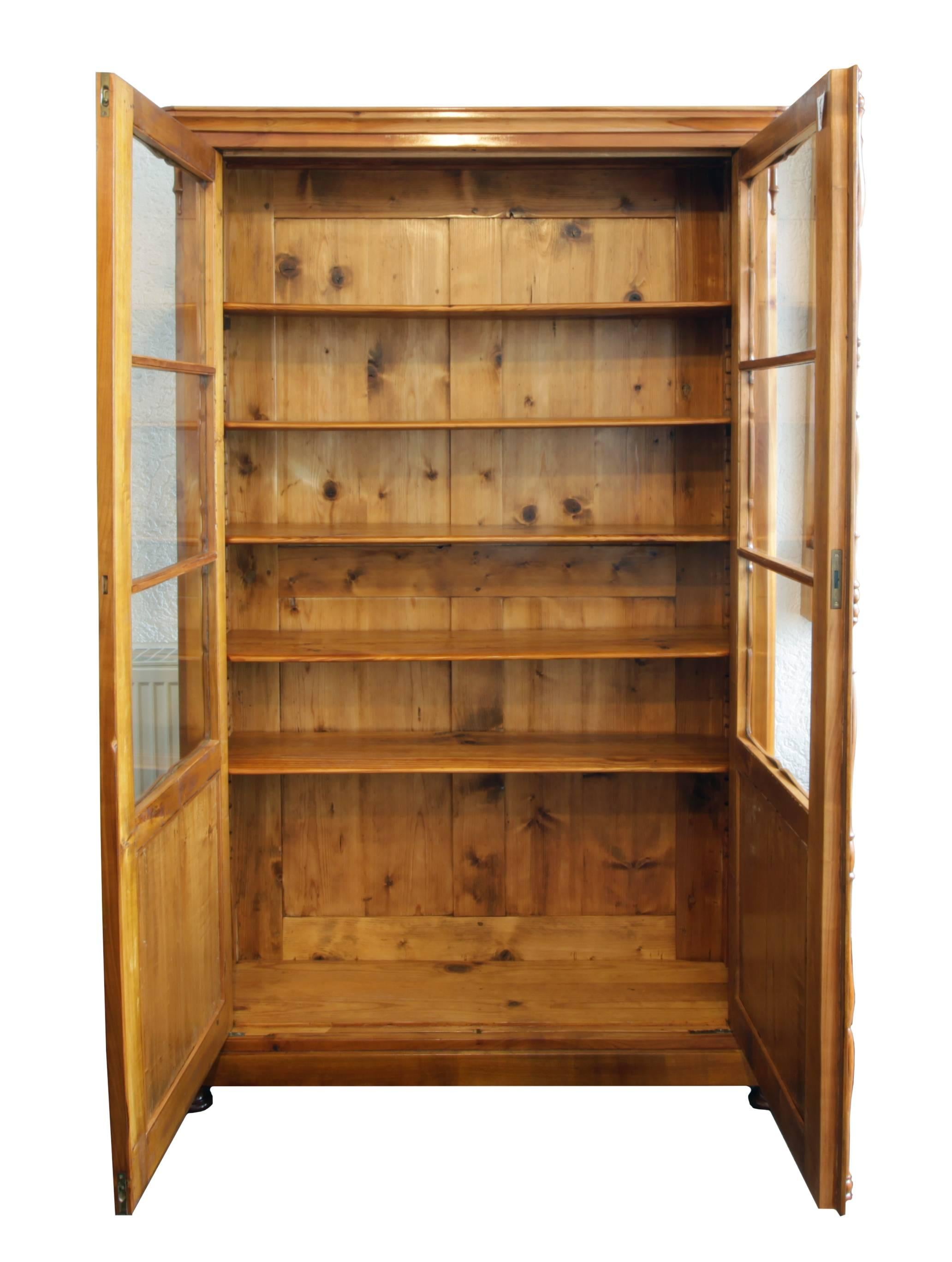 Beautiful bookcase made of solid cherrywood, interior trim and back wall made of pine wood. The cabinet dates from the late Biedermeier period / Louis Philippe. The cabinet is in very good restored condition.