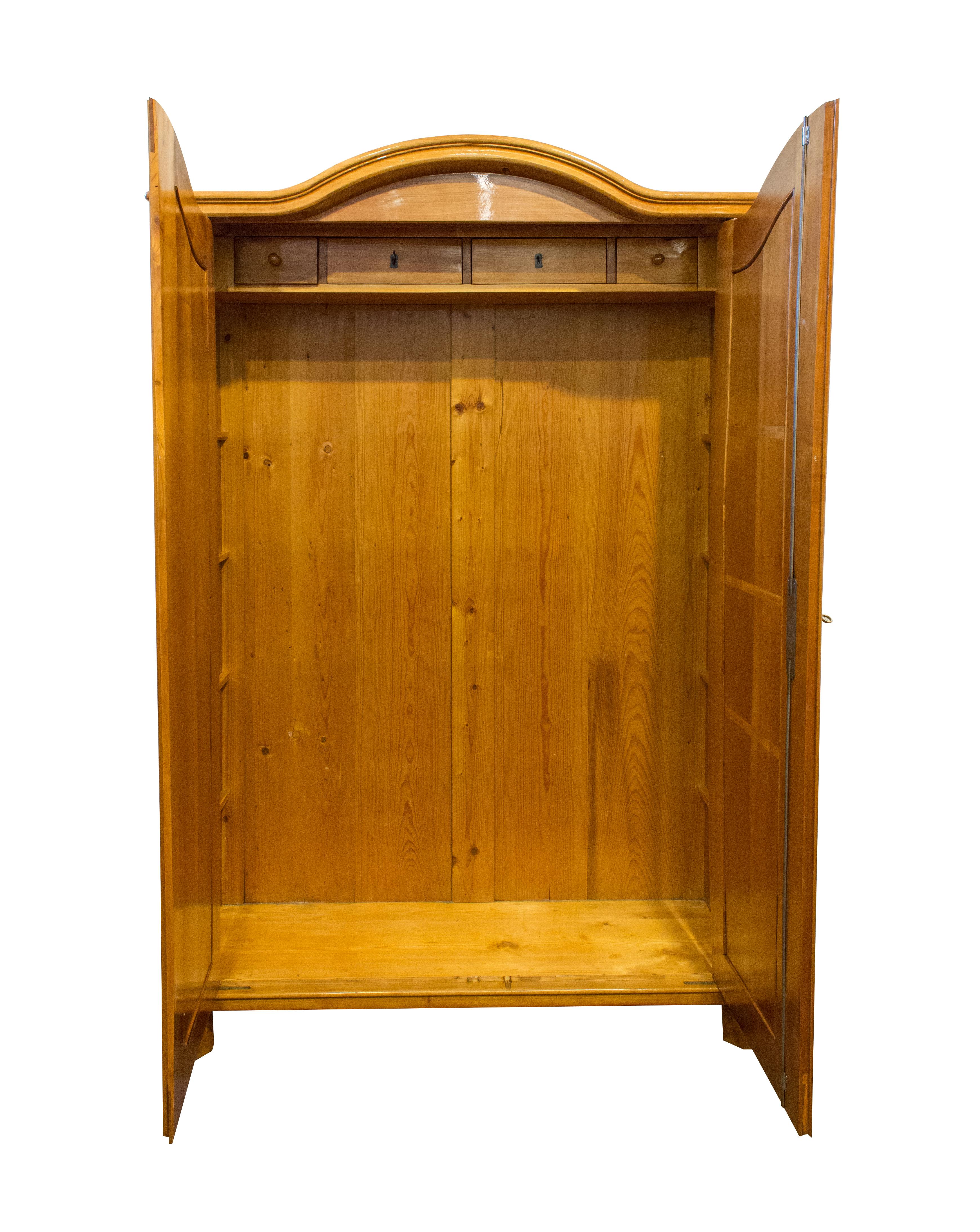 Wonderfully solid cherrywood cabinet or wardrobe. The cabinet dates from the time of the late Biedermeier period called viennese baroque. In a very well restored condition. An interior division will be made according to your wishes. The cabinet is