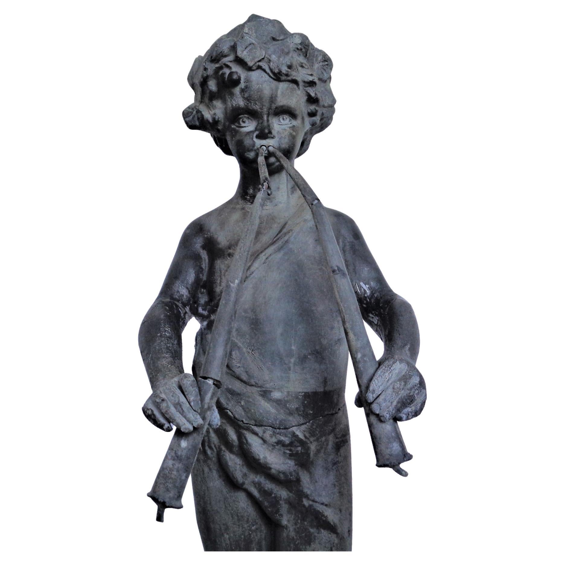  Antique lead garden figure of standing Pan with flutes ( this was once a working  fountain piece - retains period copper piping at underside bottom that goes up through inside of both flutes. Nicely detailed features in original old weathered