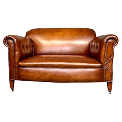 19th century leather drop arm Chesterfield sofa