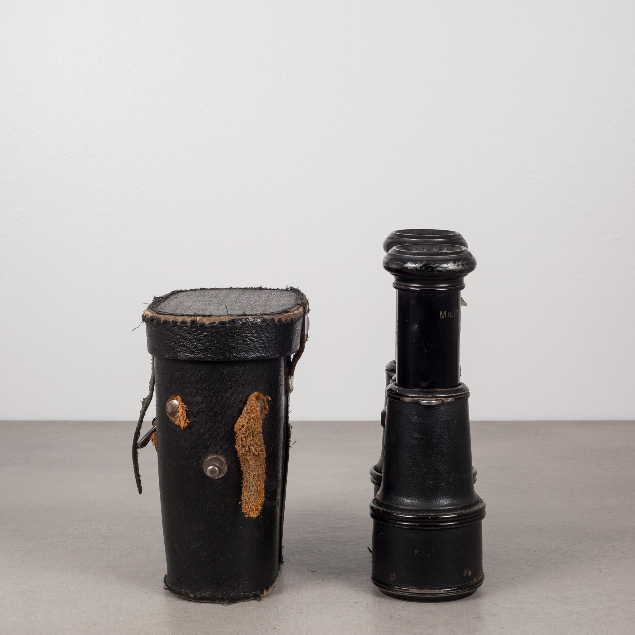 Amazing pair of antique leather wrapped binoculars that have 