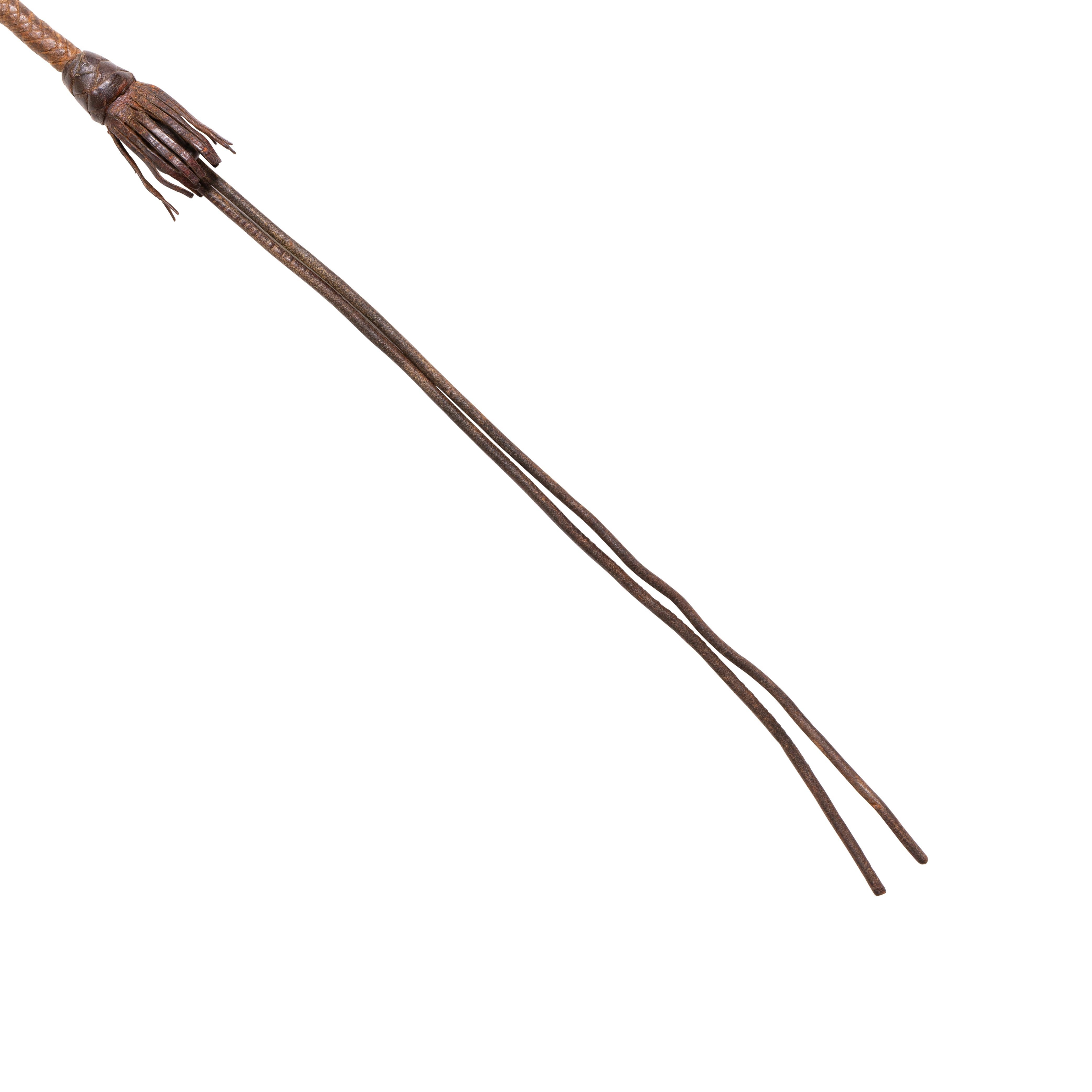 Two-tone leather quirt with fringe drops. Shot filled handle.

Period: 19th century
Origin: Montana
Size: quirt 18