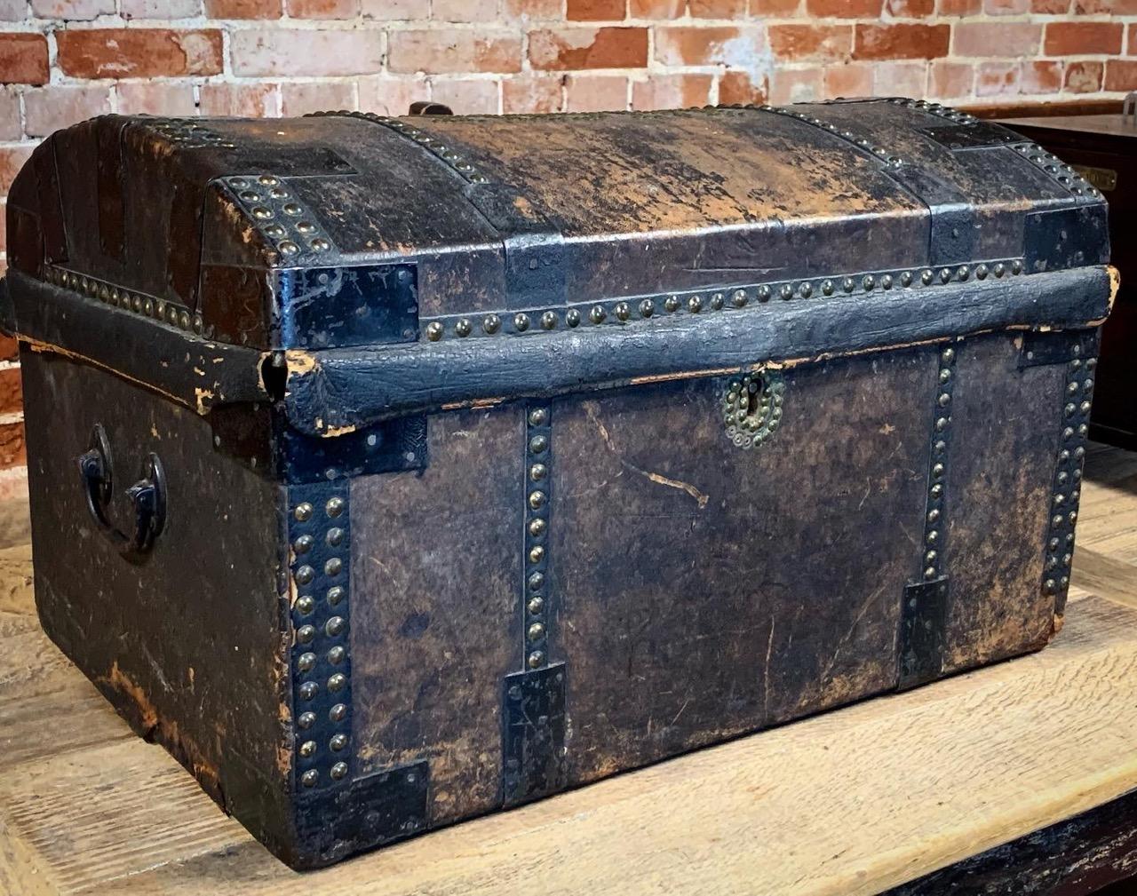 A nice 19th century leather travelling trunk with the owners initials RSM done with brass studs on the domed lid. The leather has a beautiful aged patina which gives it a good decorative look.