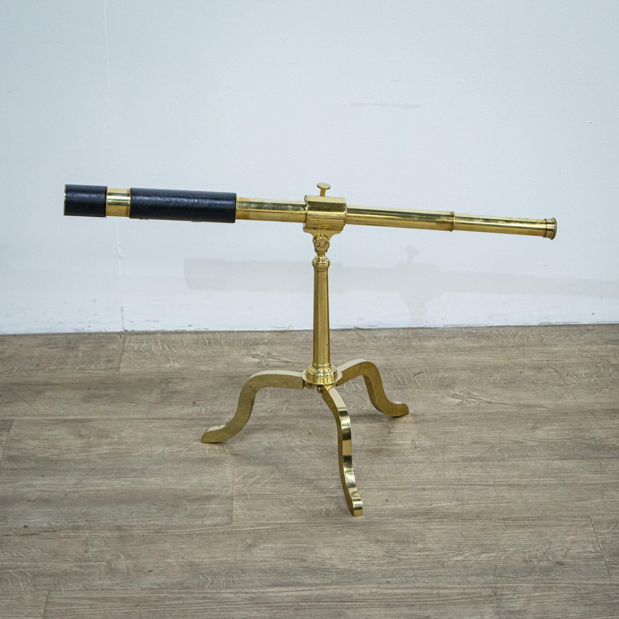 A wonderful brass telescope by Newton & Company Opticians of 3 Fleet Street, Temple Bar, London, England. This piece is of a fashionable size, perfect for any study or library setting. The scope is a three drawer with sliding eyepiece and sun shade