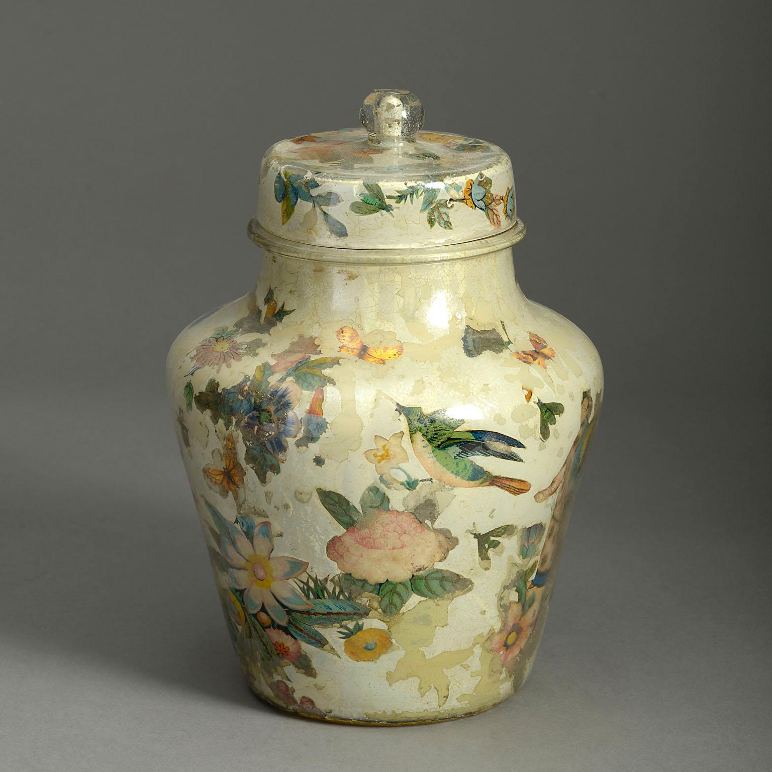 A small mid-nineteenth century lidded Decalcomania jar and cover, the knopped lid above a tapering vase base, all decorated with hand-coloured chinoiseries, internally applied, upon a cream ground.