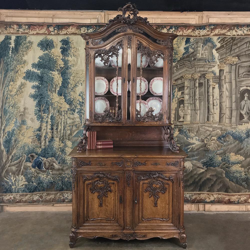 19th century Liegeois China buffet is a superlative example of the fine artistry that has been a trademark of the region for centuries! Utilizing dense, old-growth oak, the craftsmen carved shell and foliate details across the entire facade, which