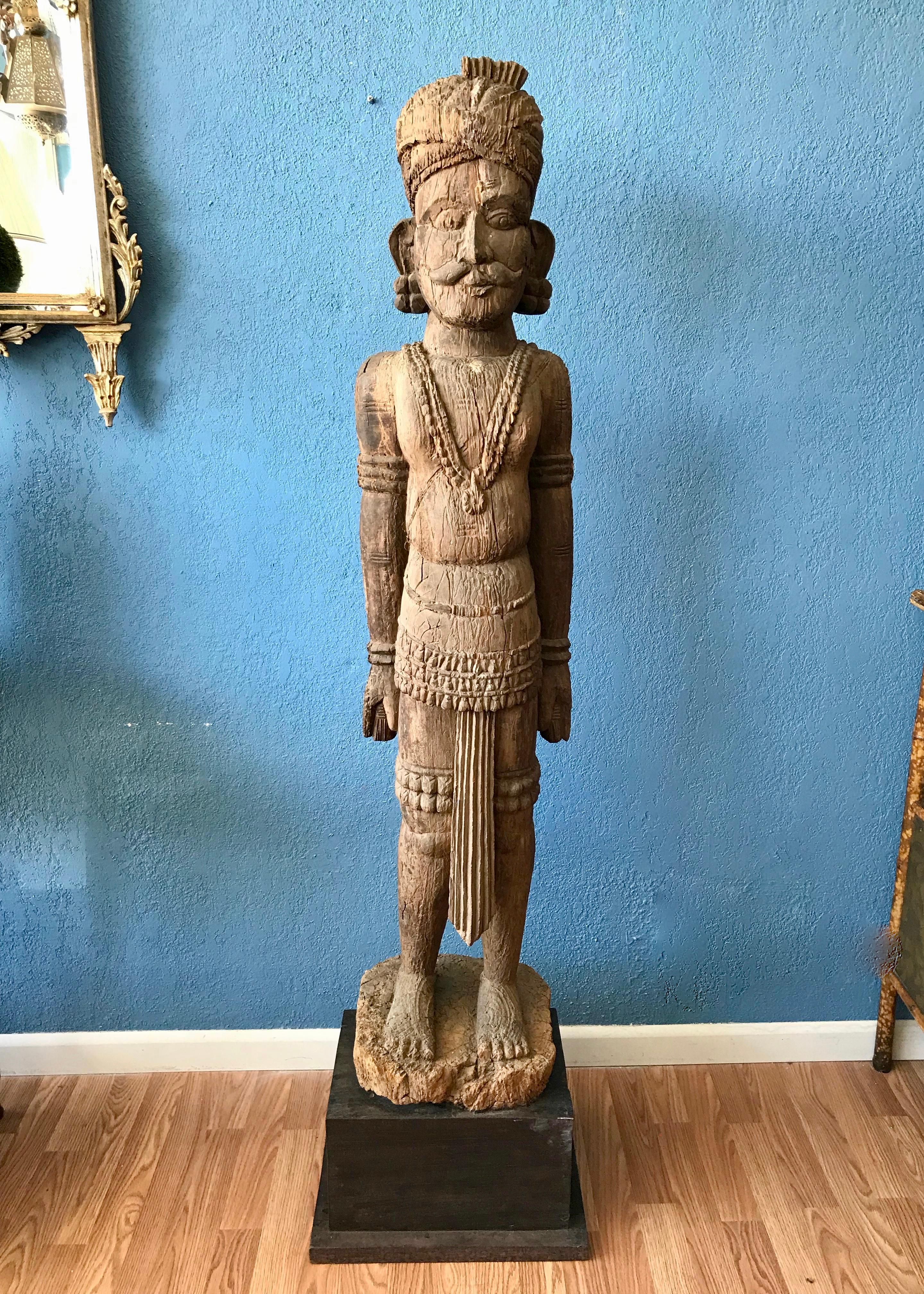 Outstanding and Dramatic Anglo Indian sculpture.
The mustachioed figure is clad in formal garb and
his head is wrapped in a traditional turban. The
unusual and bold figure appears to be carved from
a single tree trunk . The carving is