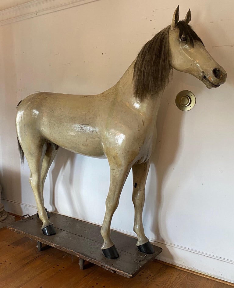 19th century life sized horse trade sign from a tack shop in Pottsville, PA. Horse is made of cast iron, wood, and papier mâché. The tail and cast iron ears are removable. Original finish. The mouth opens for a bit. Would have been used to display