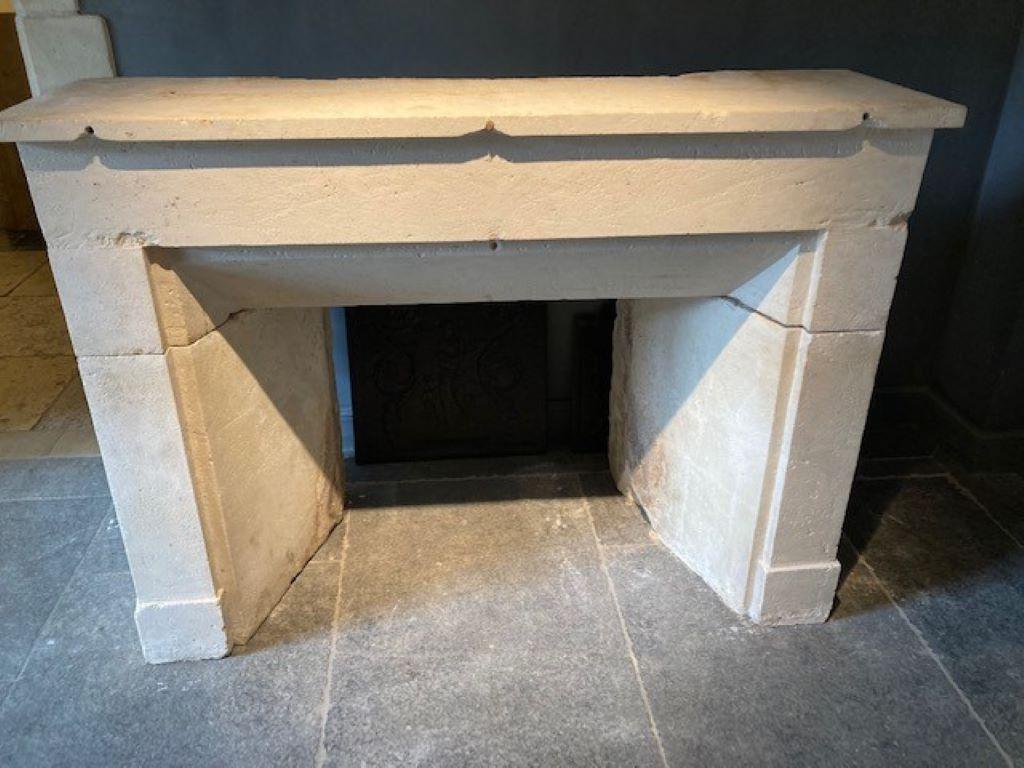 Limestone fireplace mantel dating from the 19th century.
Inside dimensions : 70cm high ; 70cm wide (back) & 102cm wide (front) 